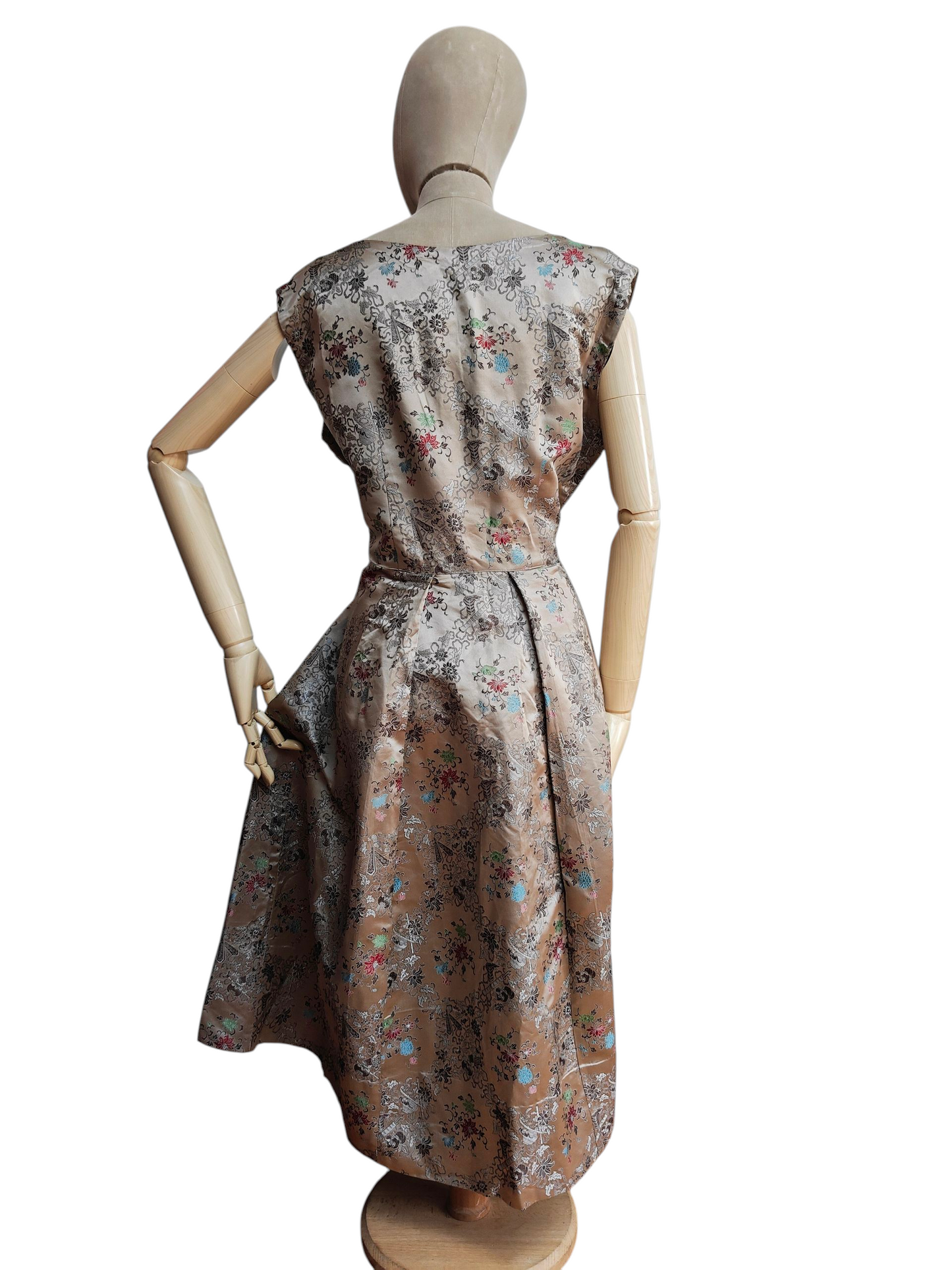 Mannequin wearing a floral dress on a white background