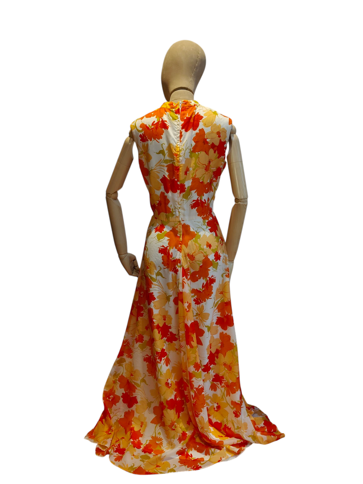 Mannequin wearing a floral dress with orange and yellow pattern on a white background