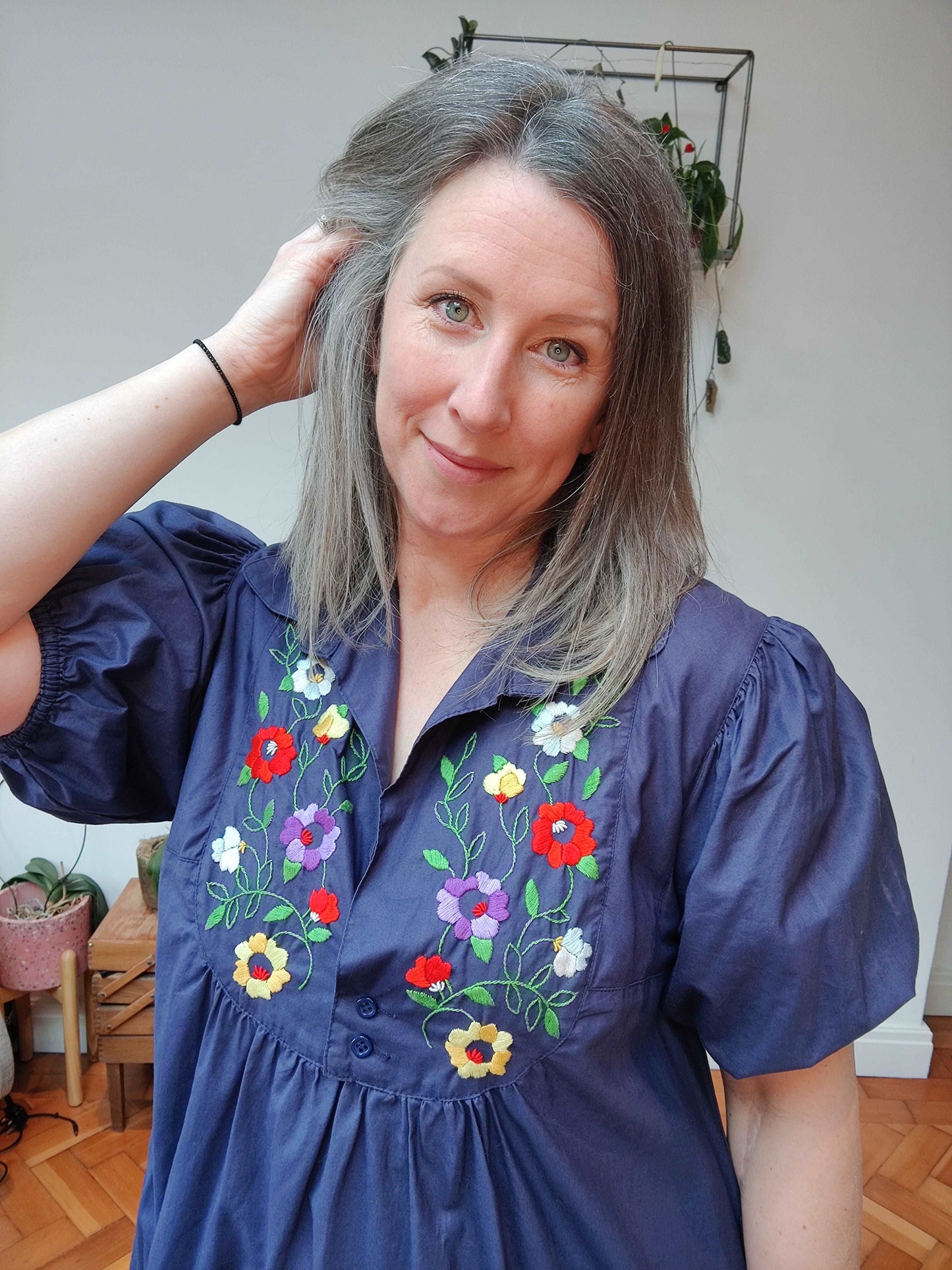 Beautiful blue smock dress with embroidered bib detail.