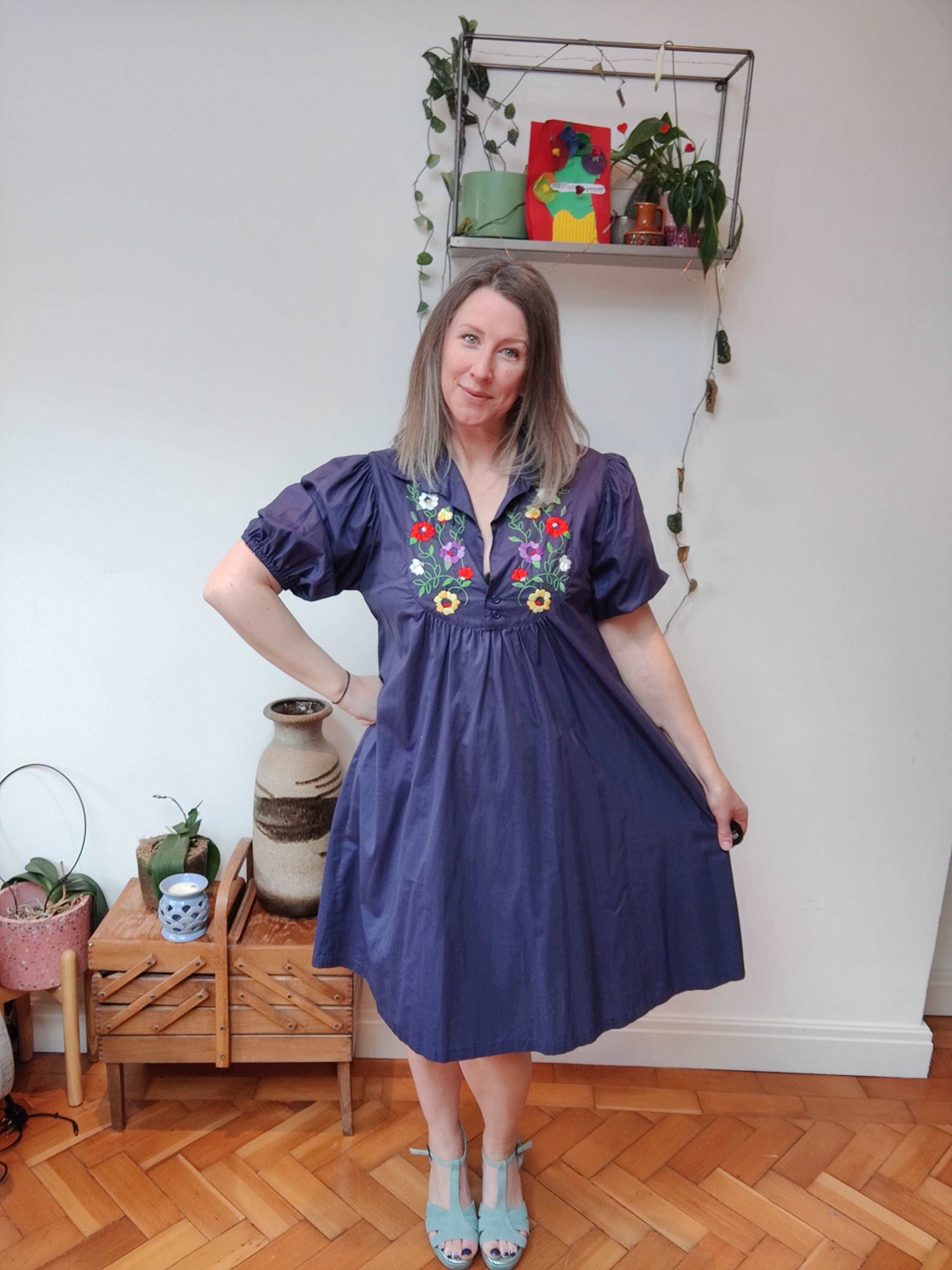 Beautiful blue smock dress with embroidered bib detail.