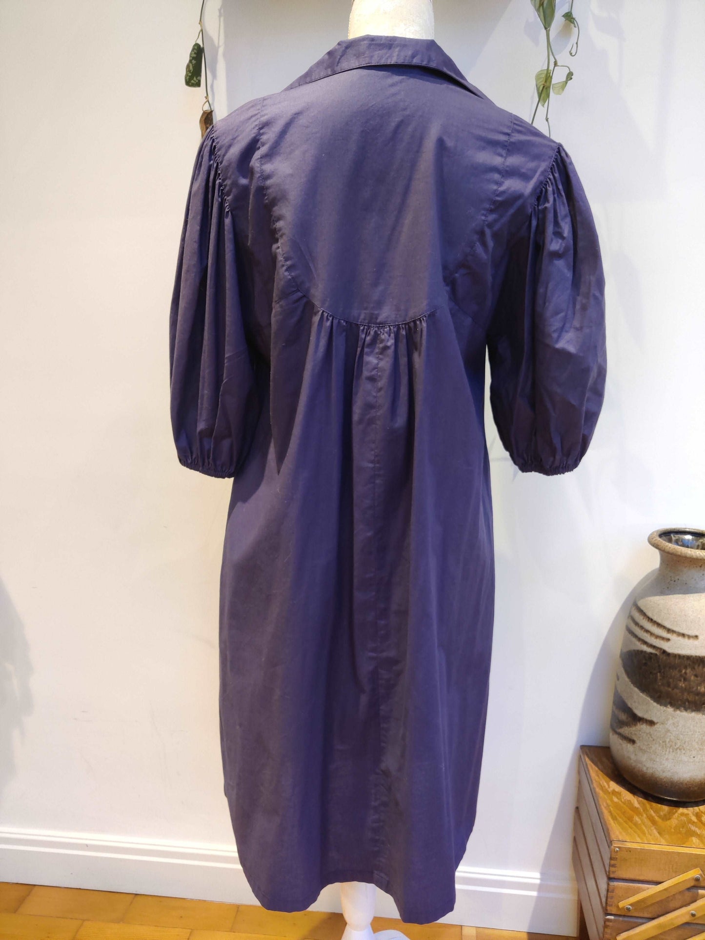 Beautiful blue smock dress with embroidered bib detail.