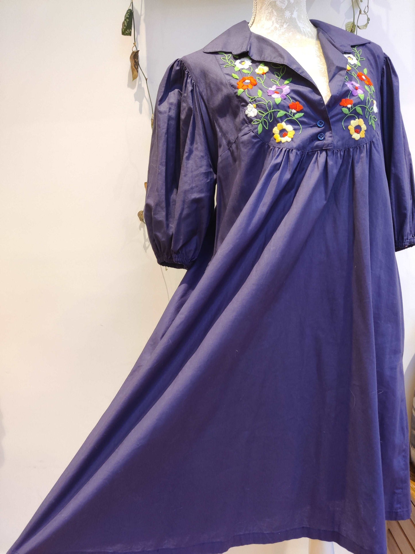 Beautiful blue smock dress with embroidered bib detail.