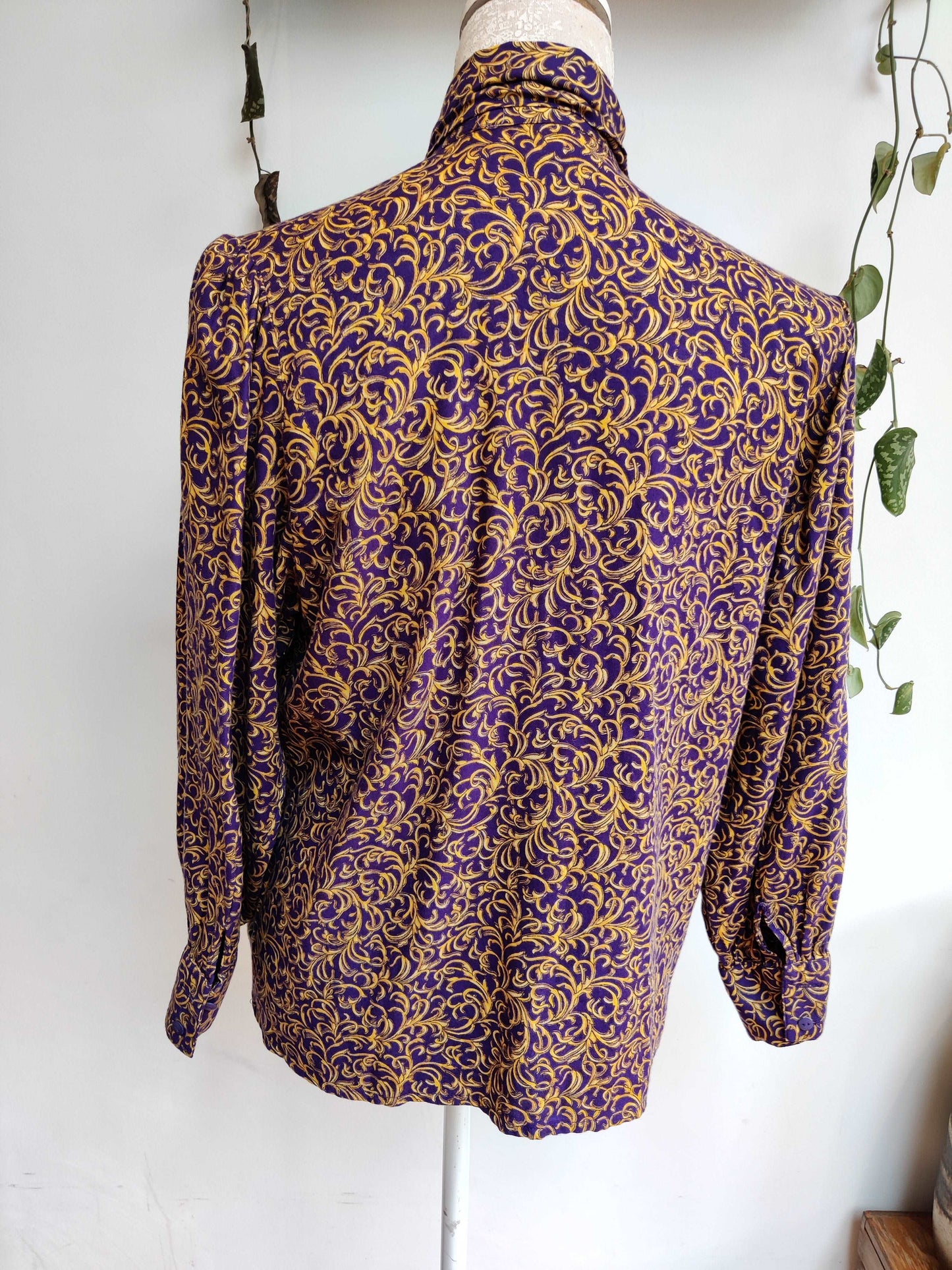 Beautiful 80s pussybow blouse in purple and gold print. Size 12-14.