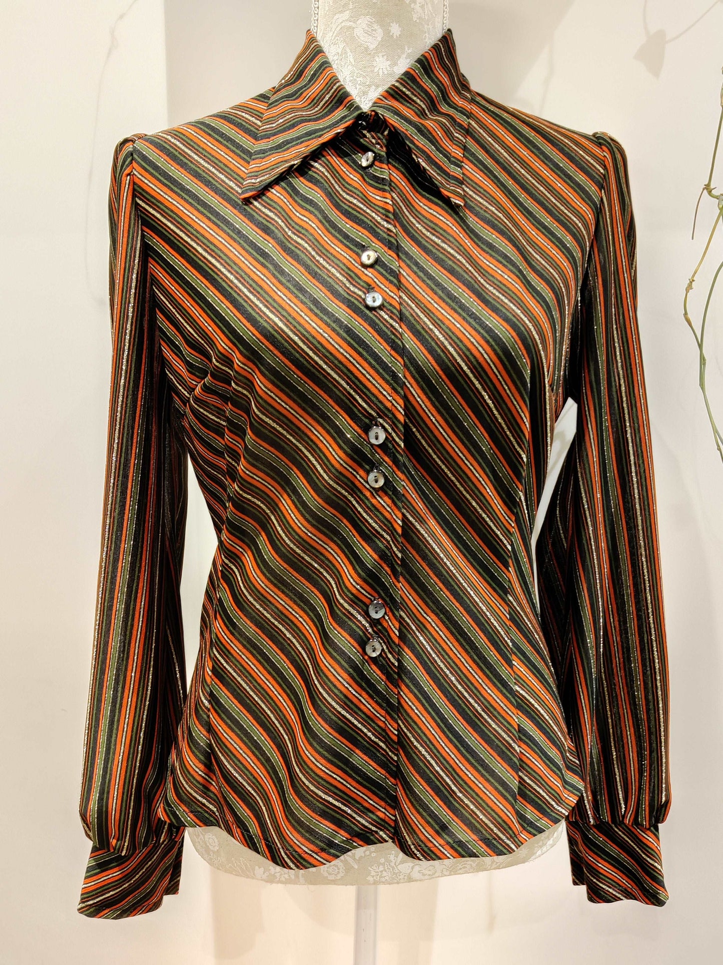 Stunning red, green and gold lurex shirt with dagger collar.