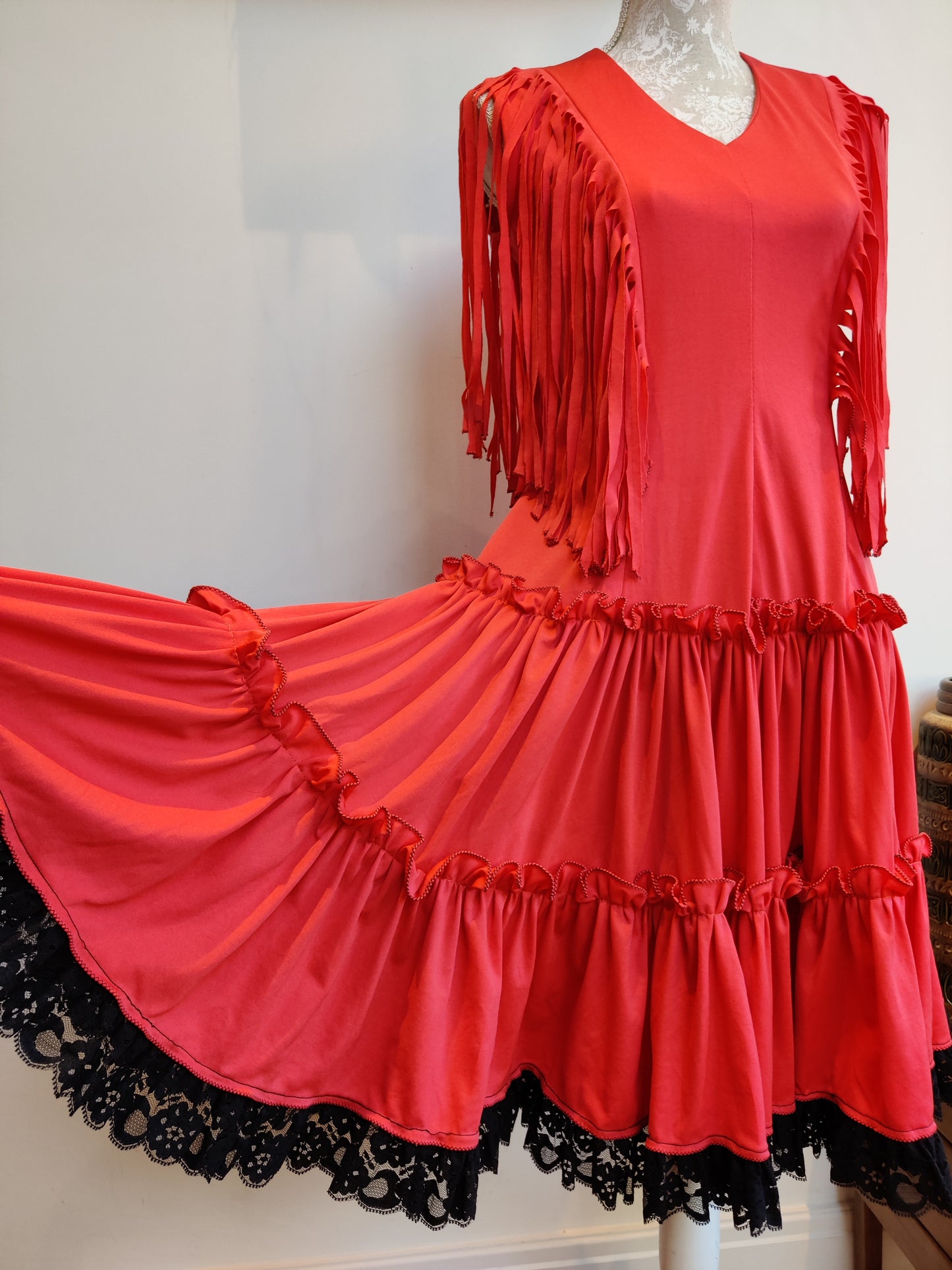 Red vintage dress with black lace trim.