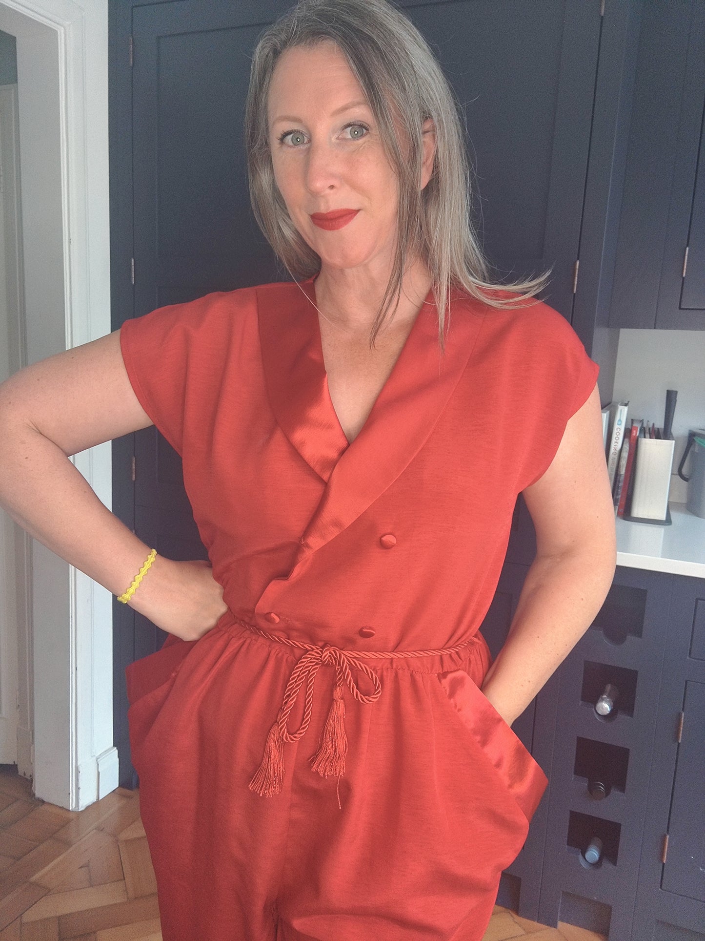 Bright red statement jumpsuit. 80s style.