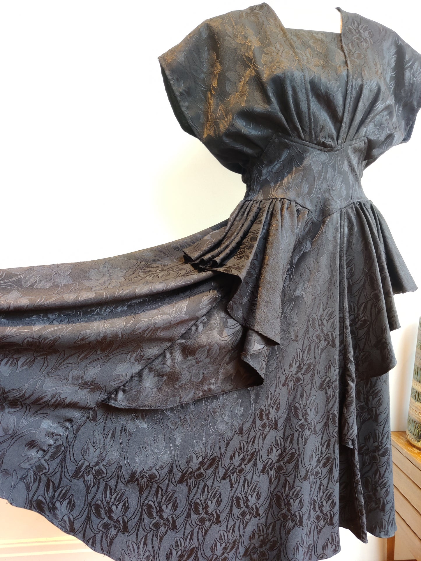 black floral dress with waterfall frills