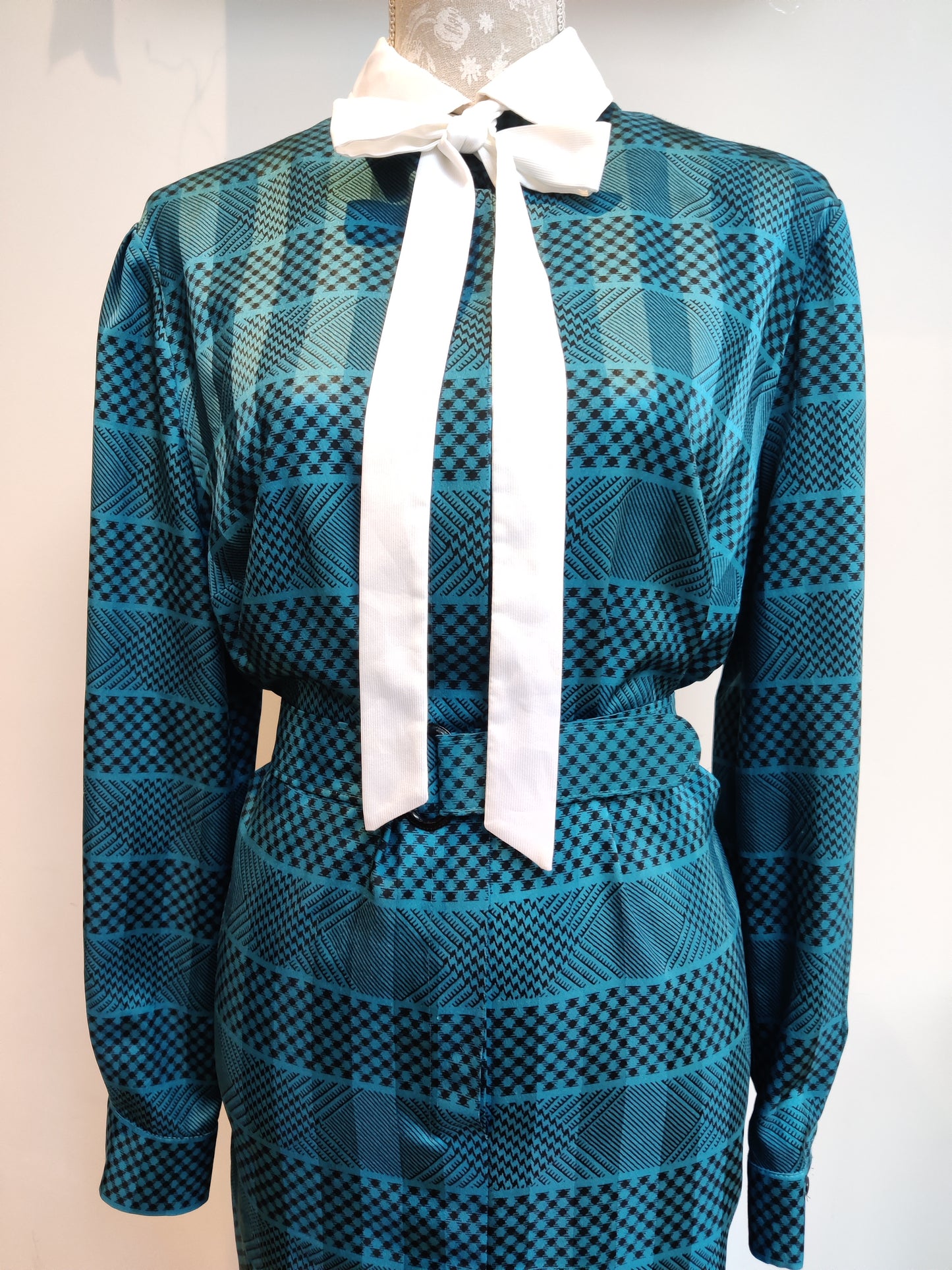 Blue and black 80s power dress with pussy bow