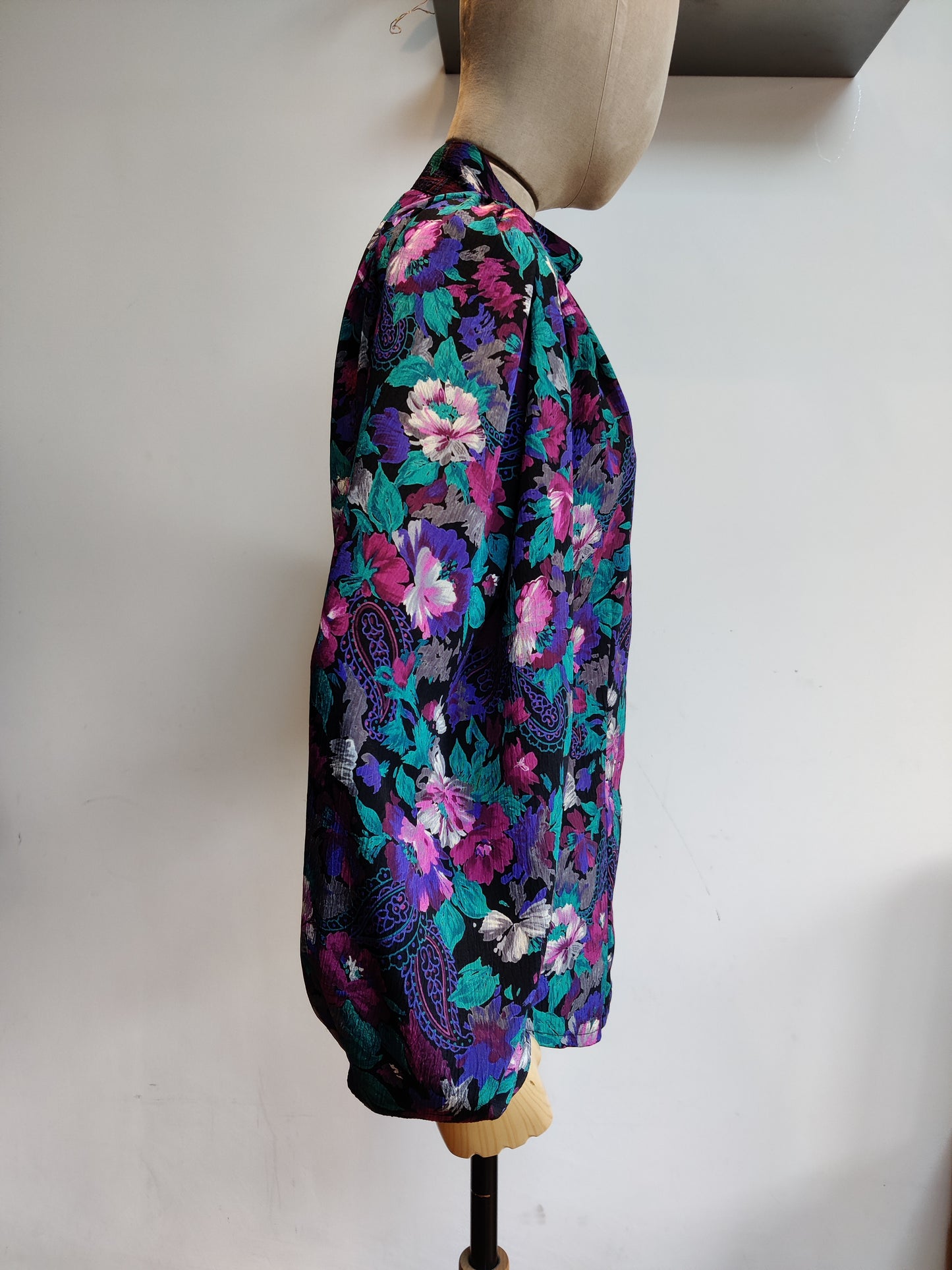 Black vintage shirt with pink and purple floral design. 