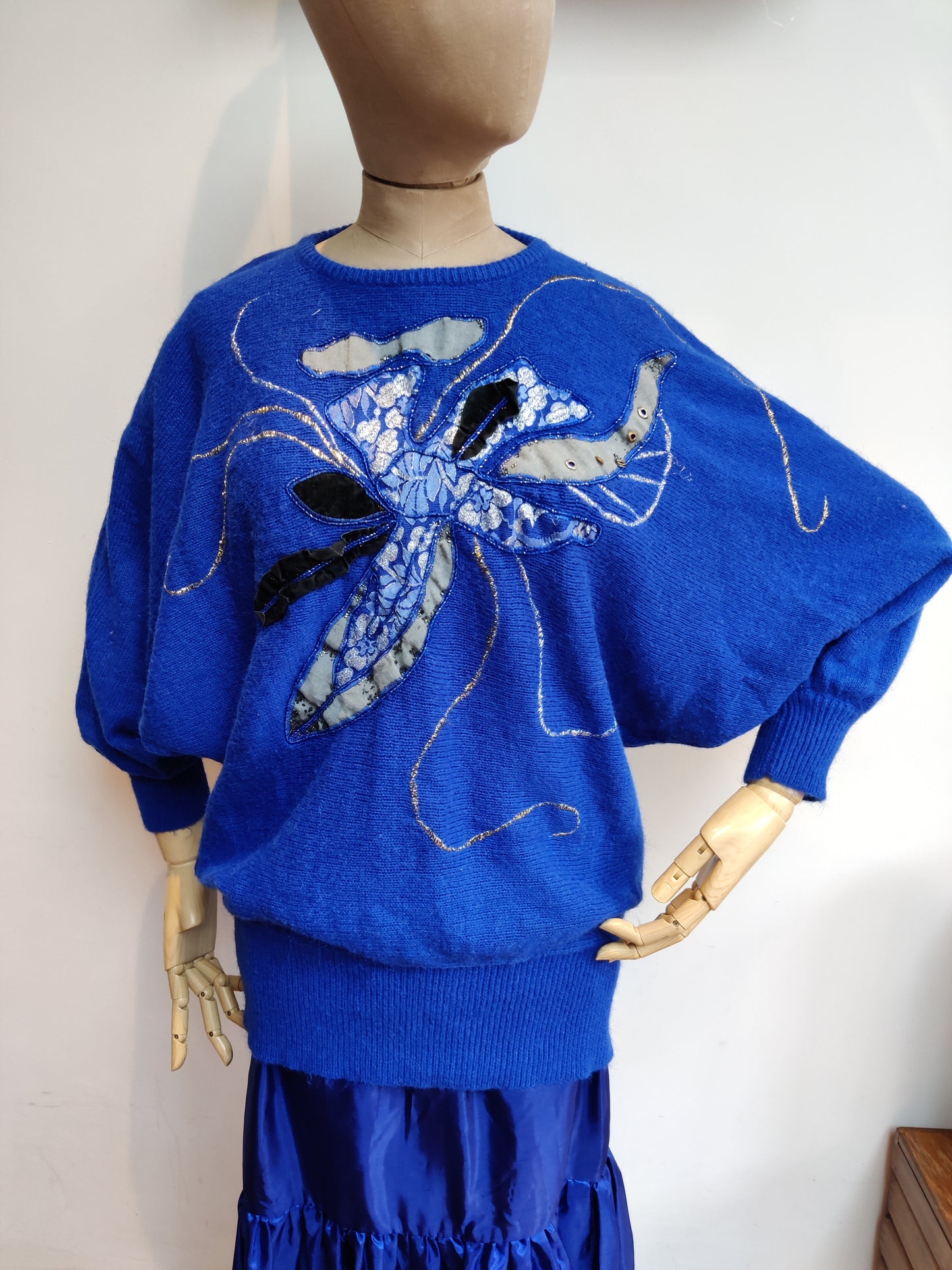 Bright blue 80s jumper with lace and beaded applique detail.