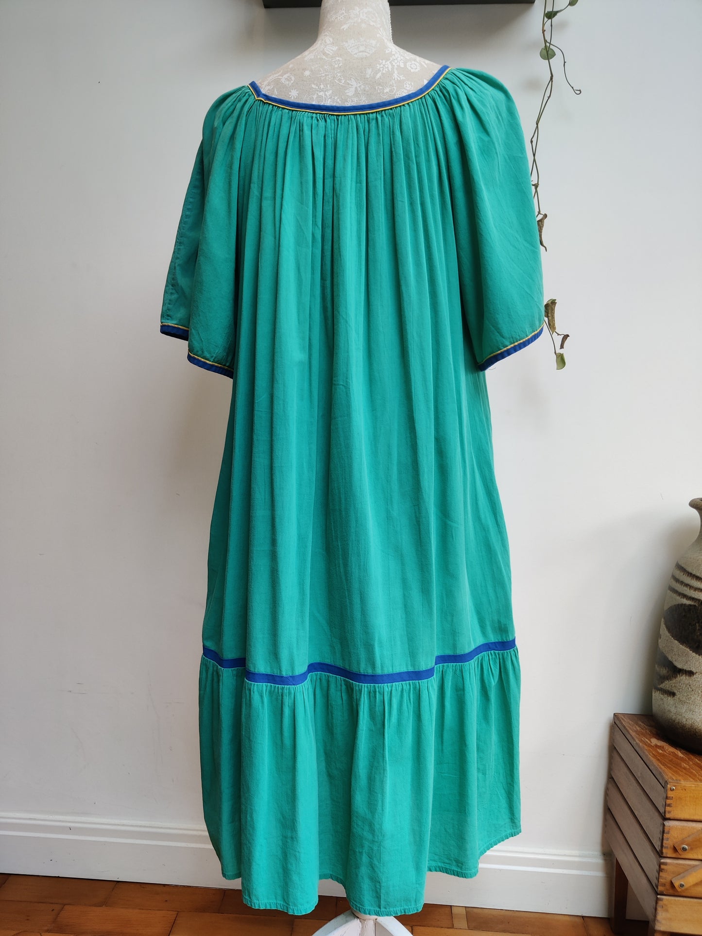Green dress with rainbow bird embroidery