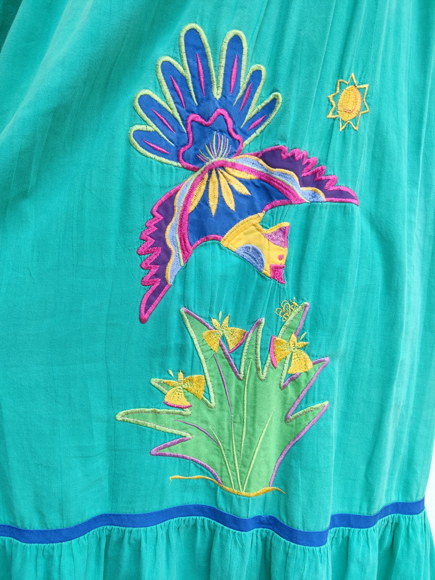 Appel dress with bird motif.