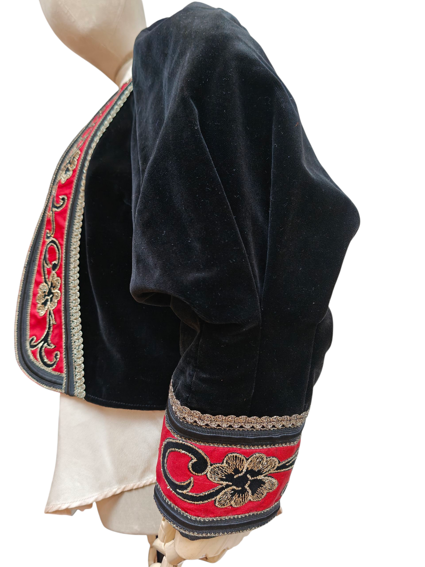 Black embroidered jacket on a mannequin with a white background