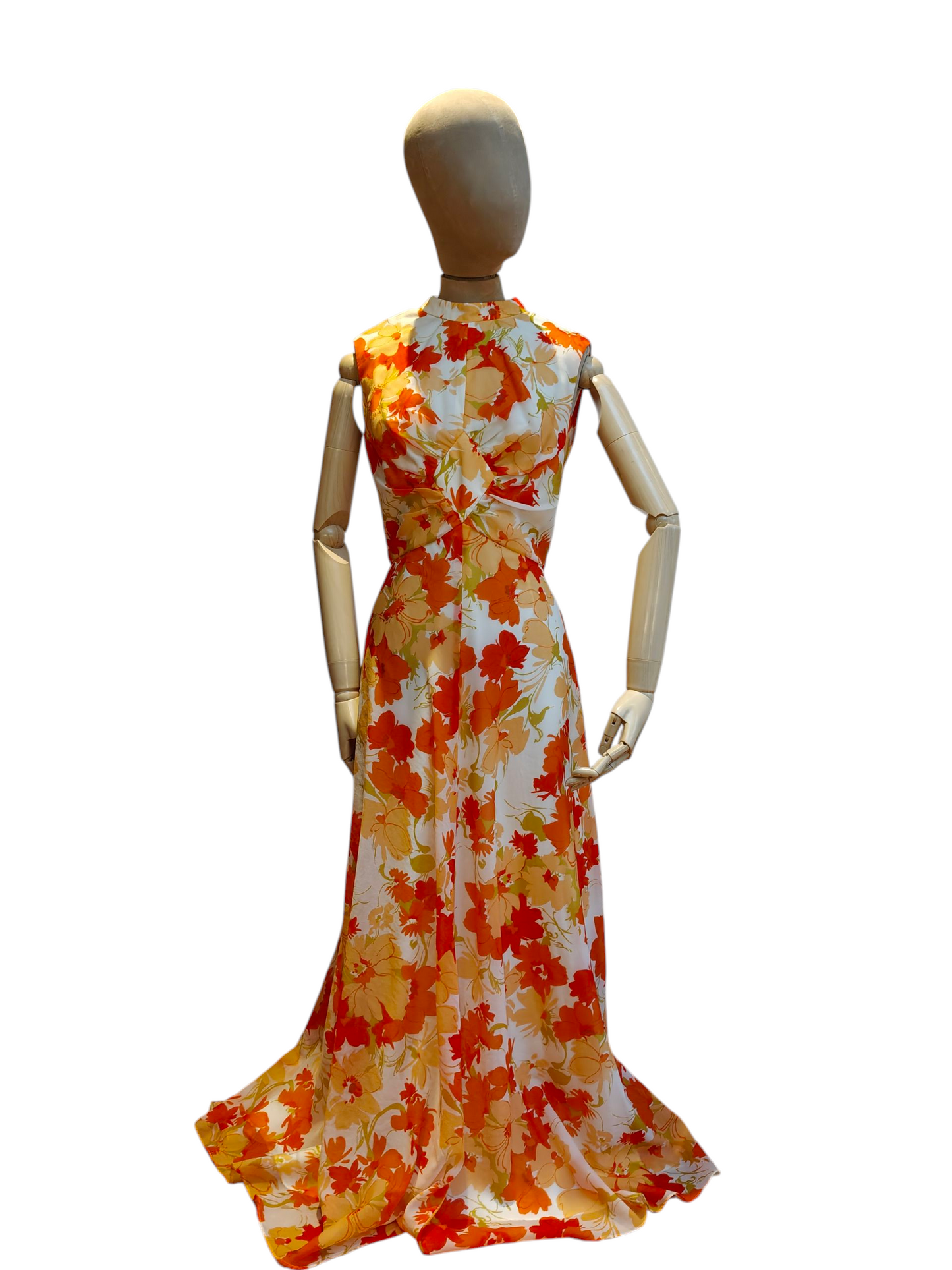 Mannequin wearing a vintage floral dress with orange, yellow, and white pattern on a white background