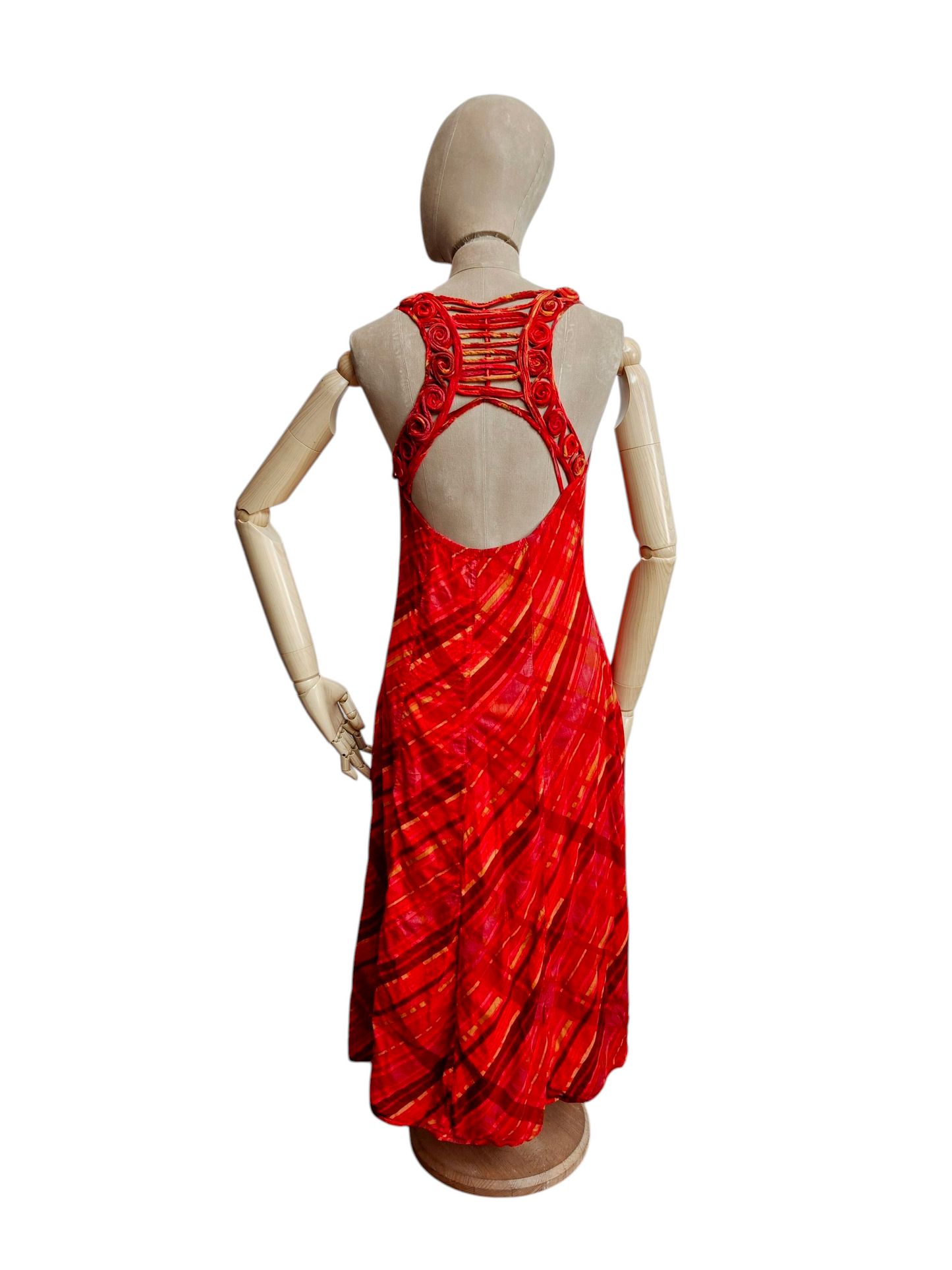 Red dress on a mannequin against a white background
