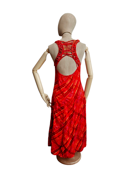 Red dress on a mannequin against a white background