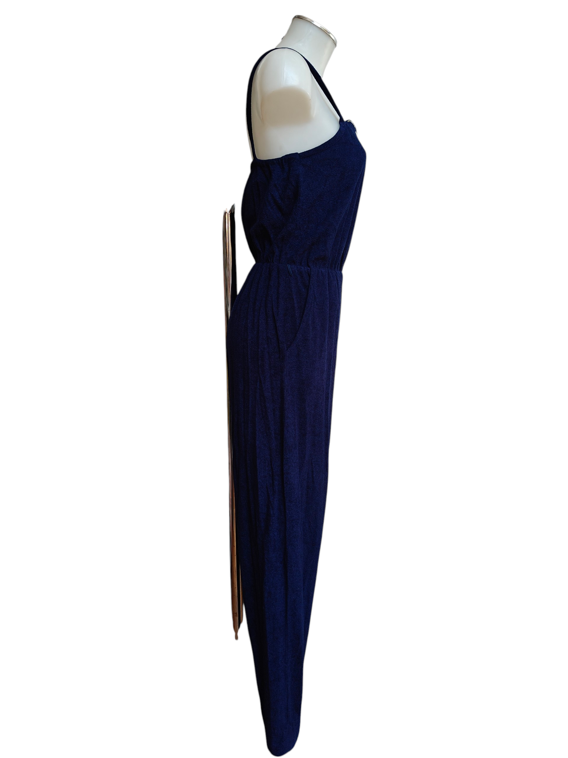 Navy blue 1980s jumpsuit on a mannequin against a white background