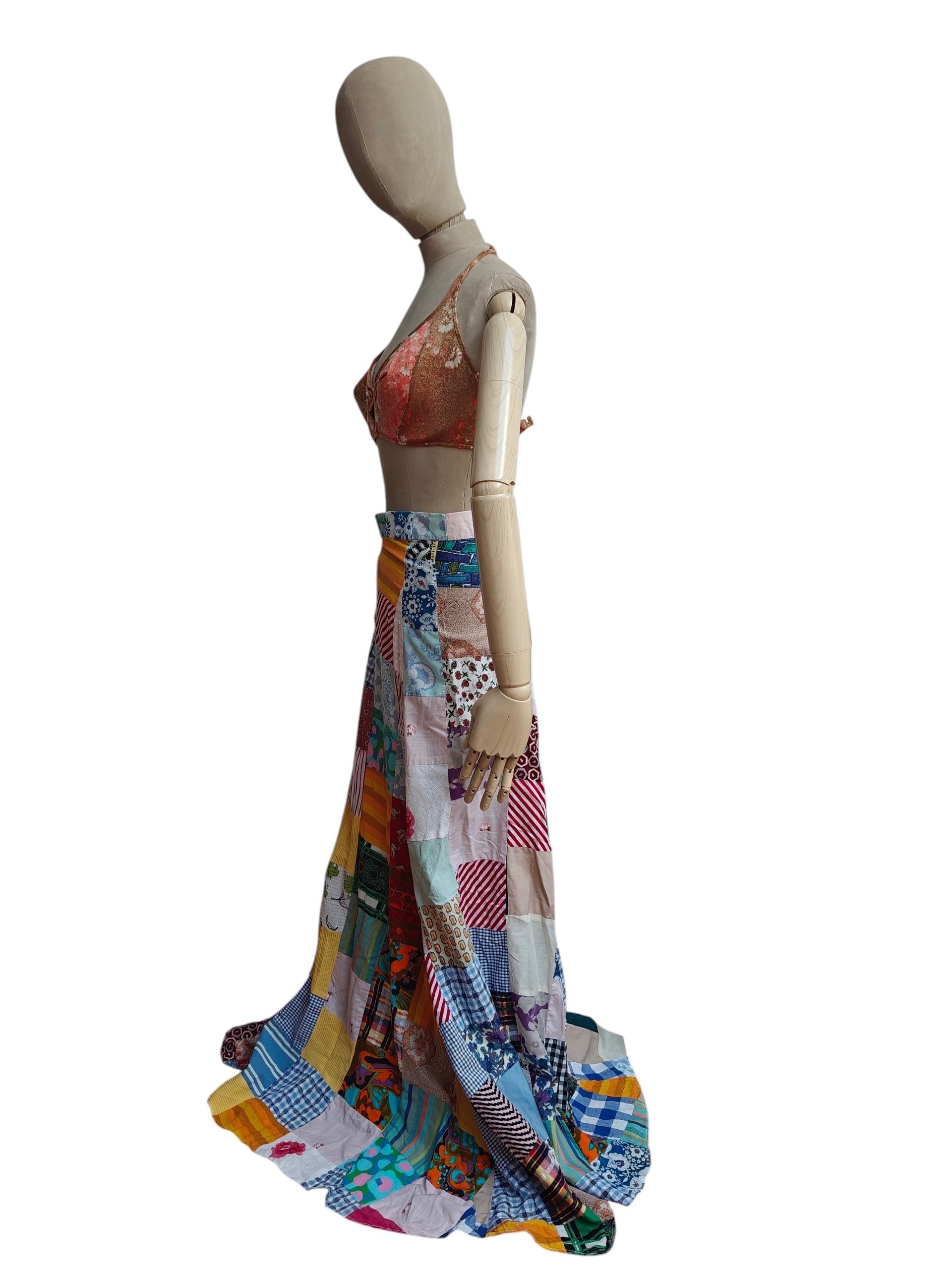 Mannequin wearing a colorful patchwork skirt on a white background