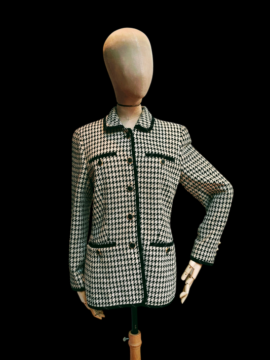 Houndstooth patterned jacket on a mannequin against a black background