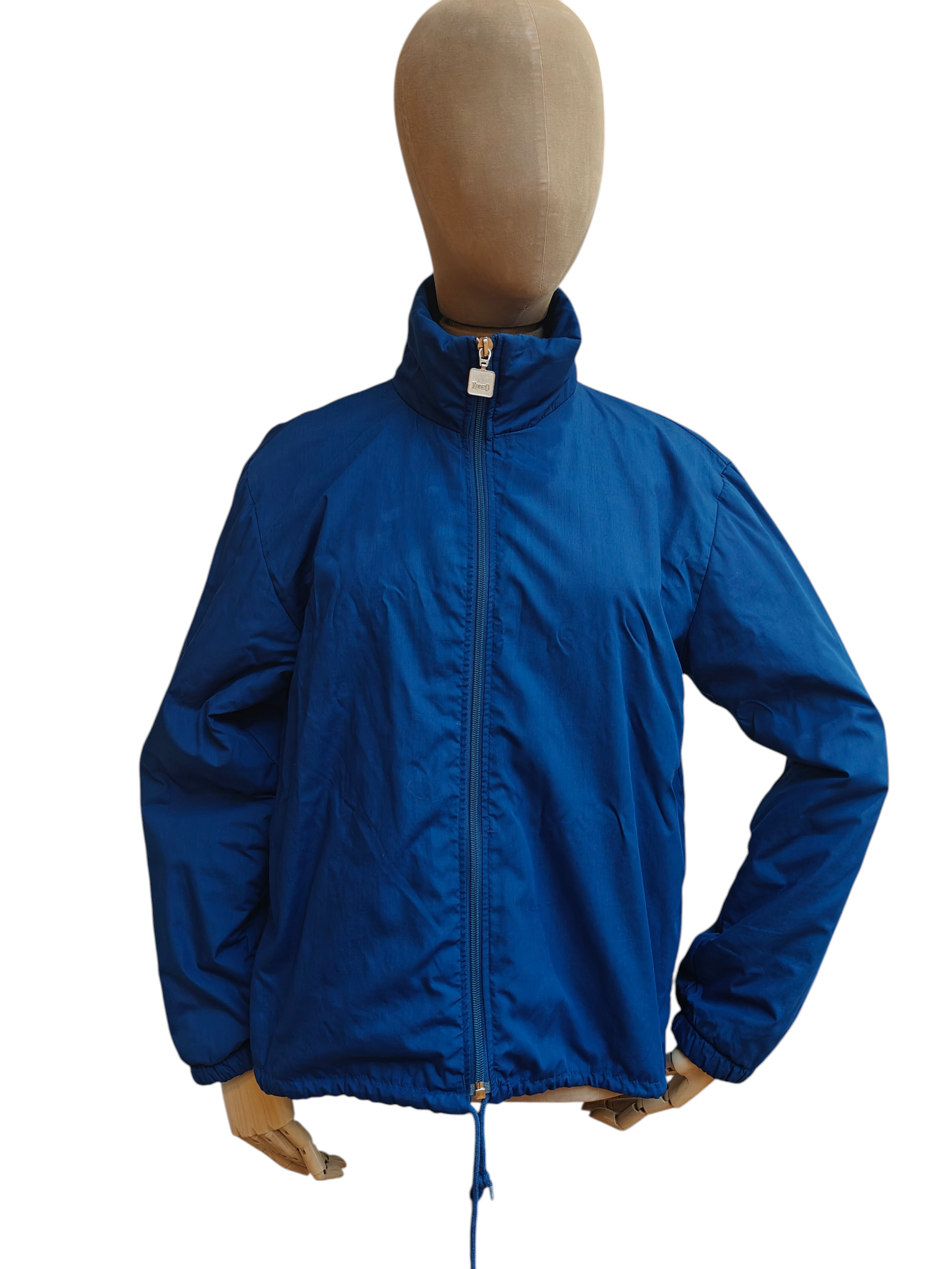 Blue jacket on a mannequin against a white background