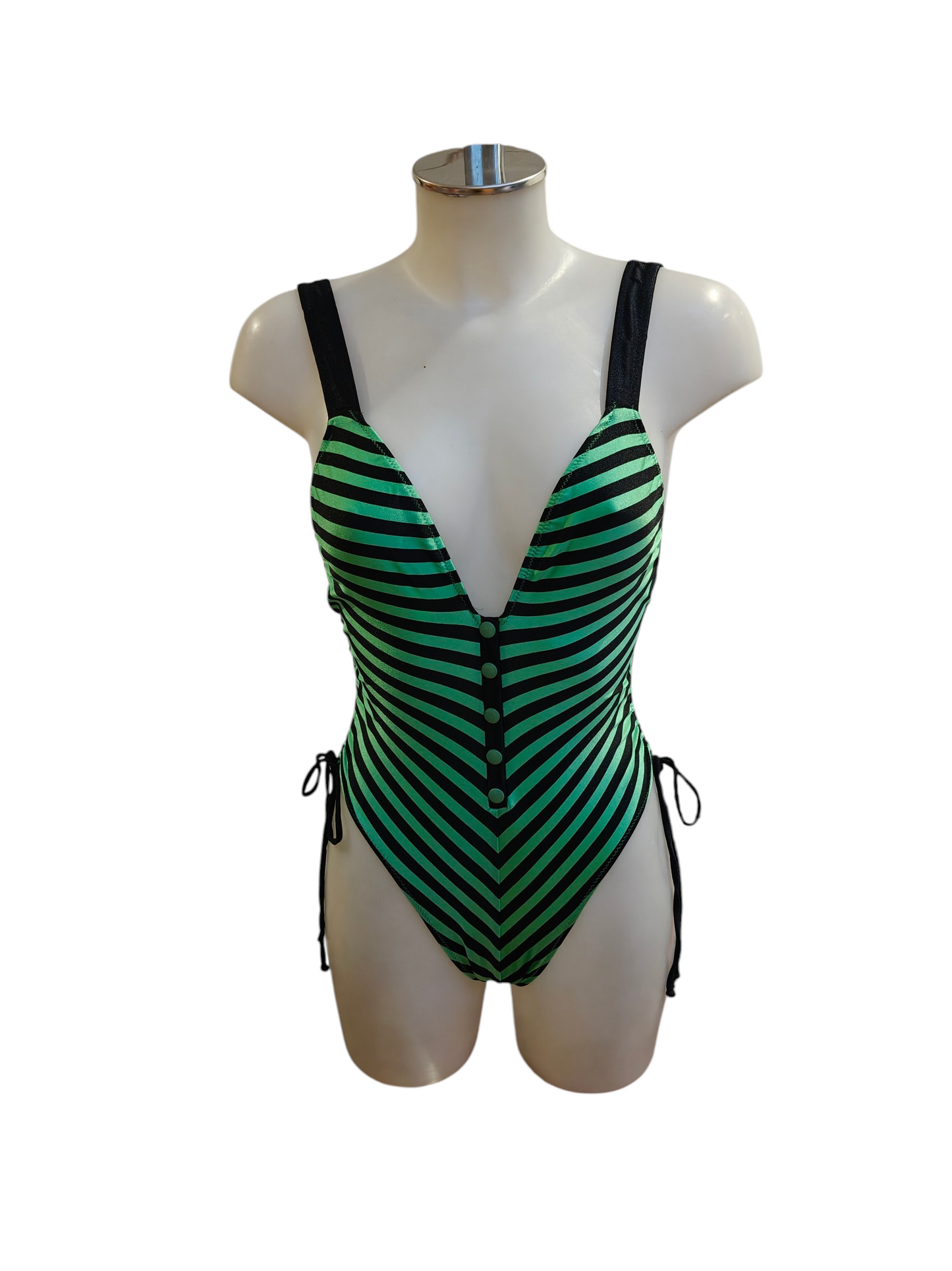 Green and black striped swimsuit on a mannequin against a white background