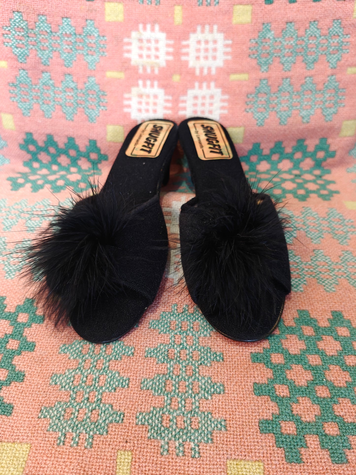 Black wedge slippers with feather detail