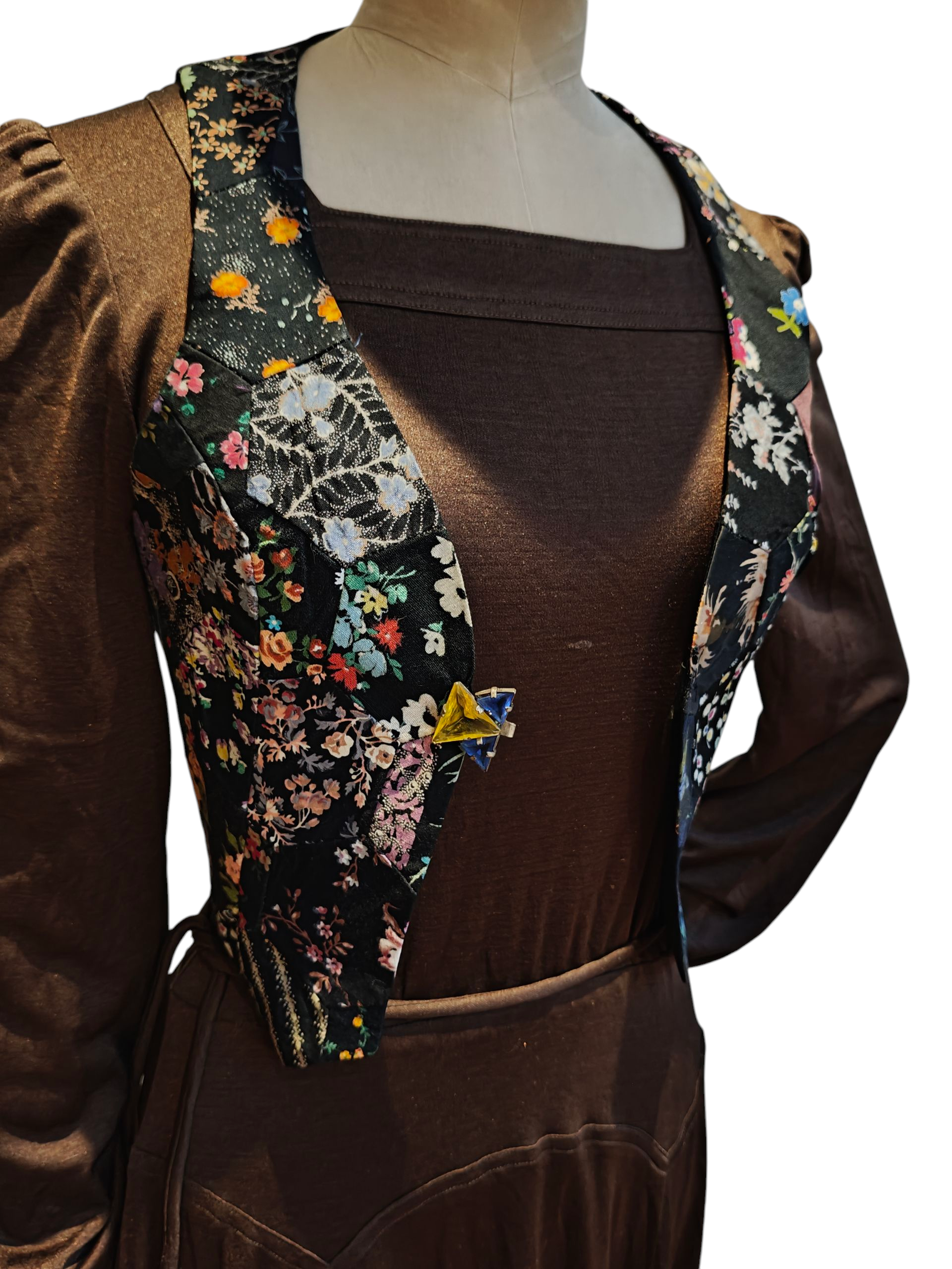Blue and yellow glass clasp on floral waistcoat