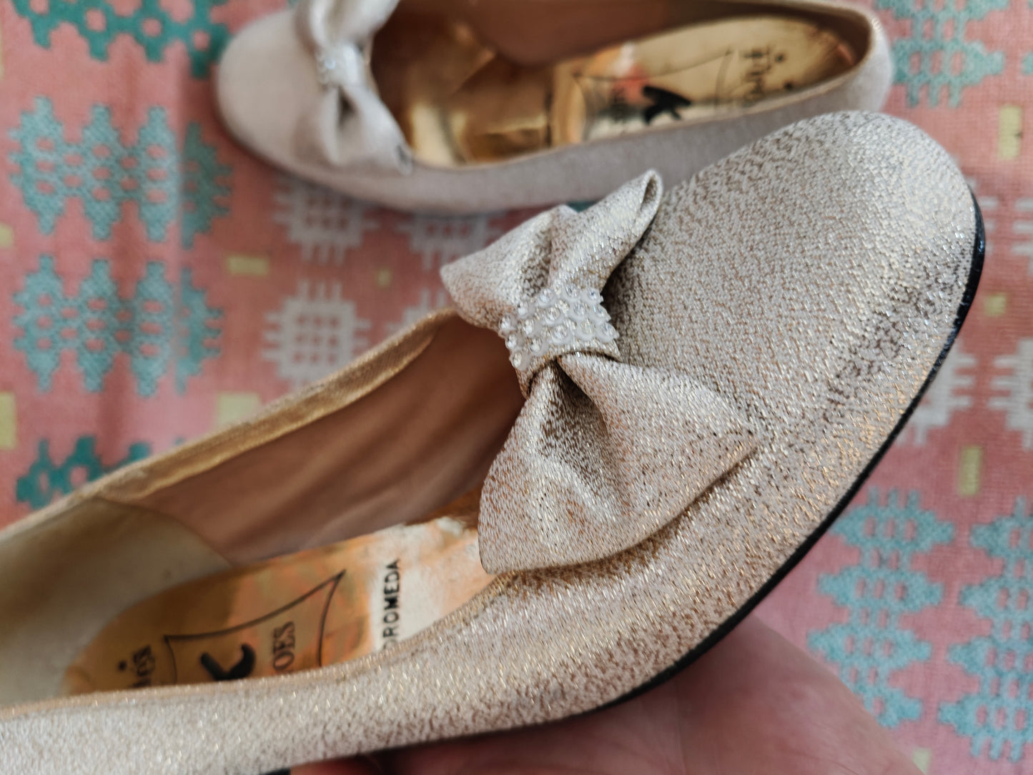 Close up of modette shoes in gold glitter
