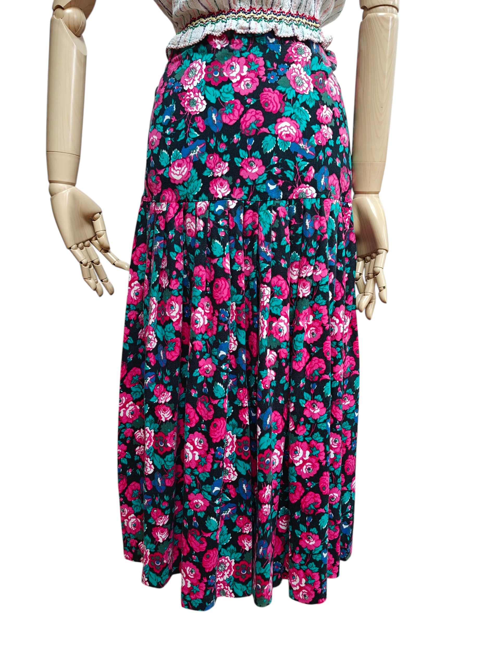 Floral patterned skirt on a mannequin against a white background