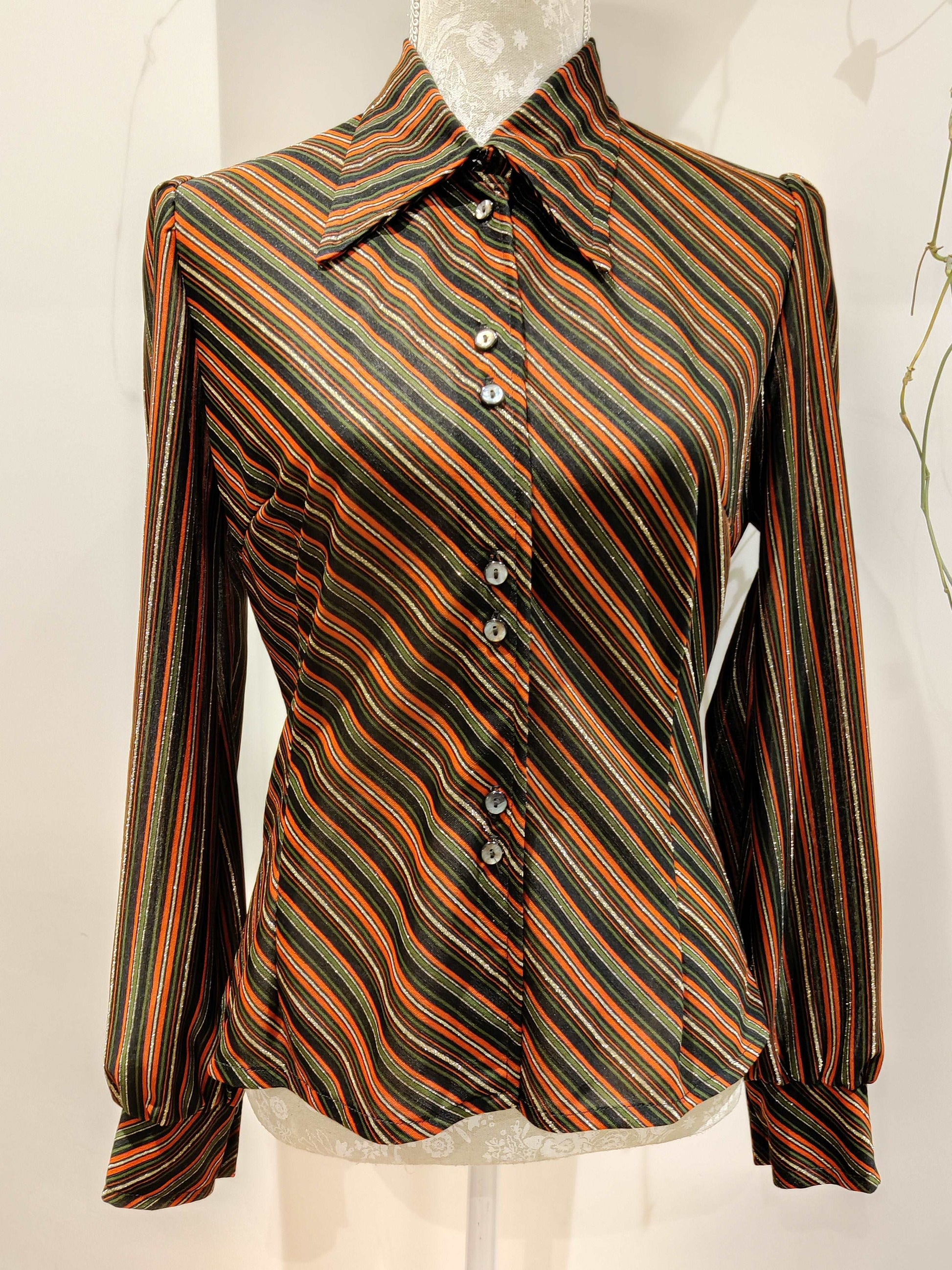 Stunning red, green and gold lurex shirt with dagger collar. 