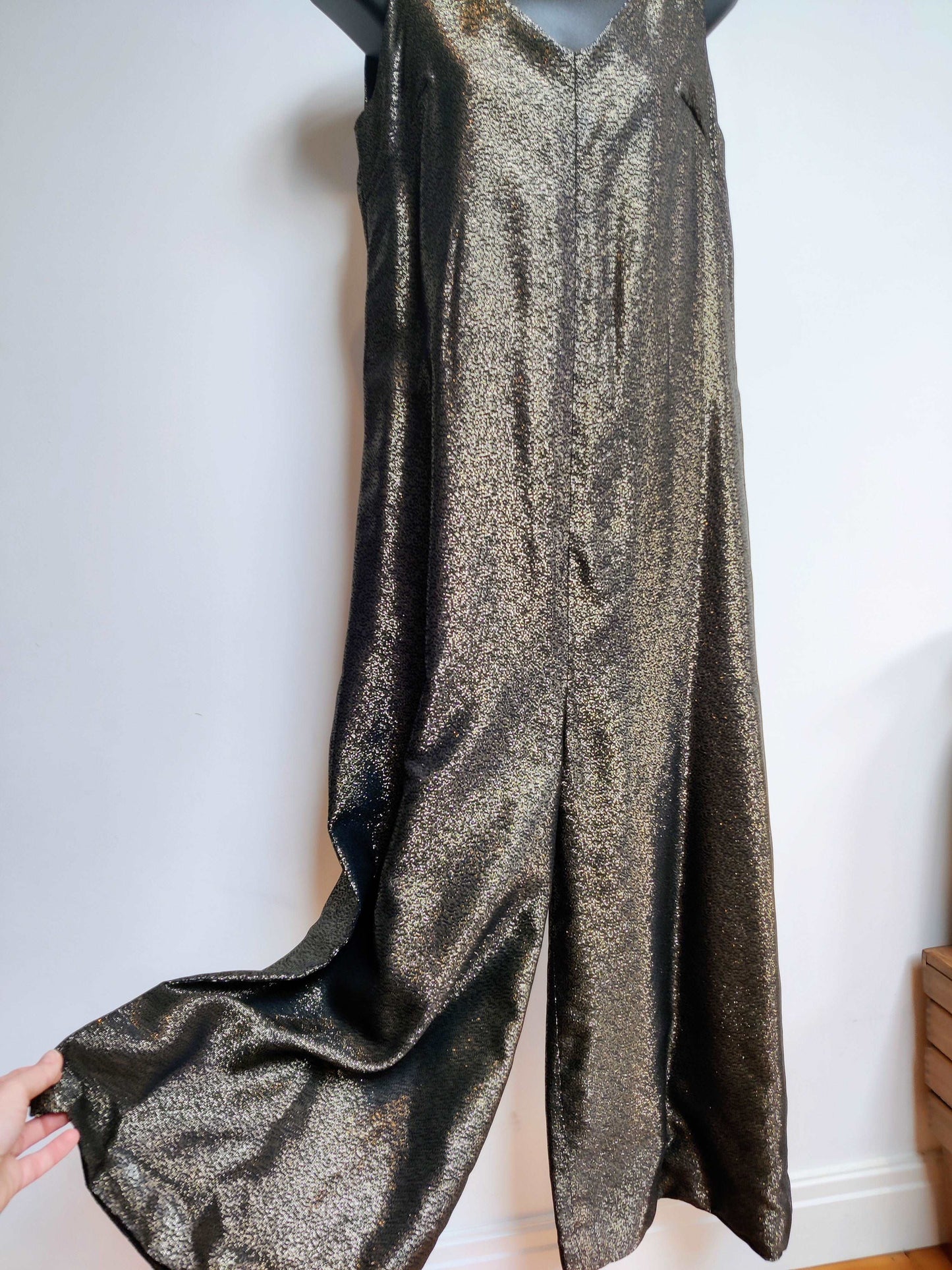70s flared jumpsuit with gold sparkle.