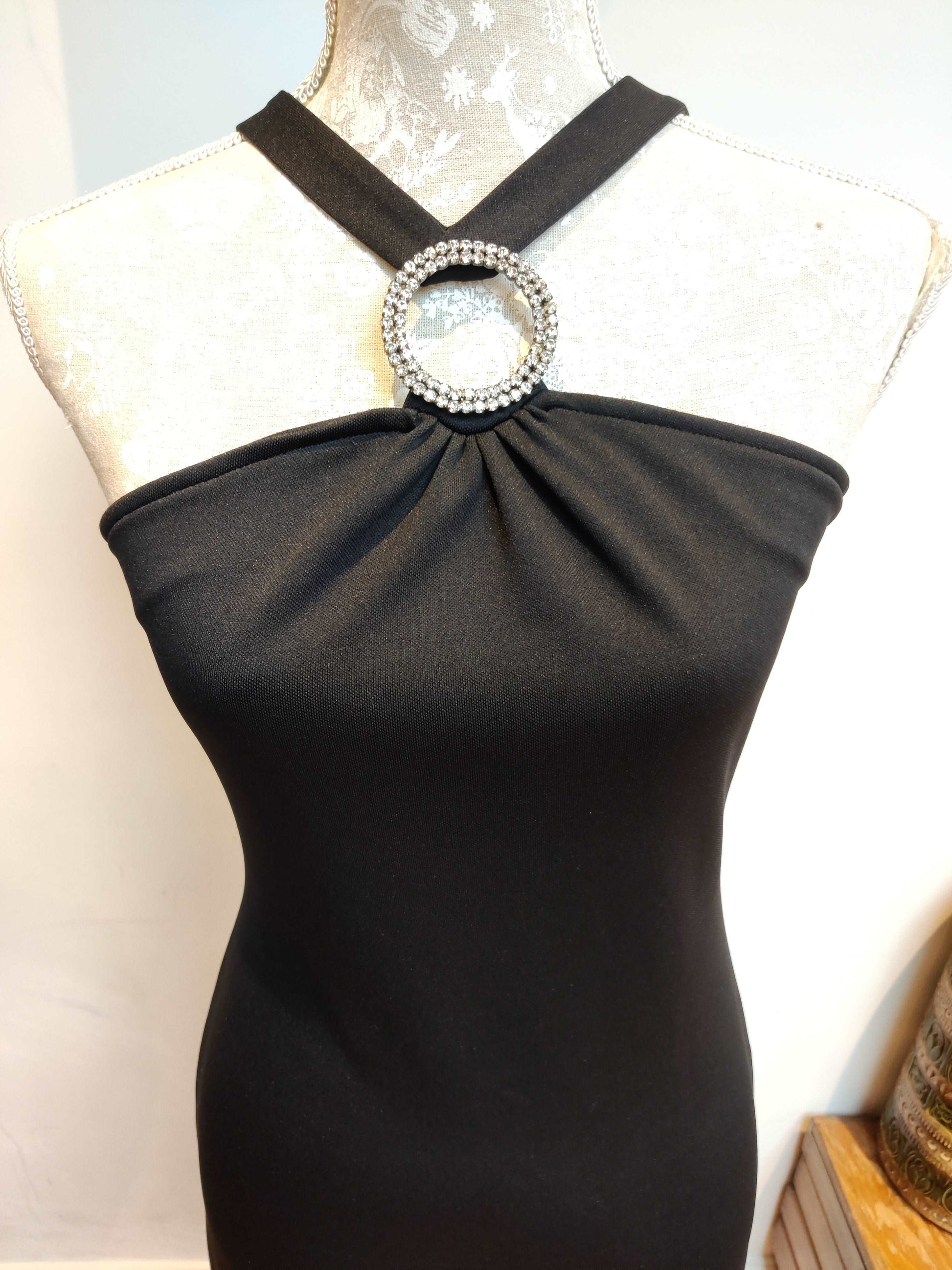 Black vintage maxi dress with diamante ring detail.