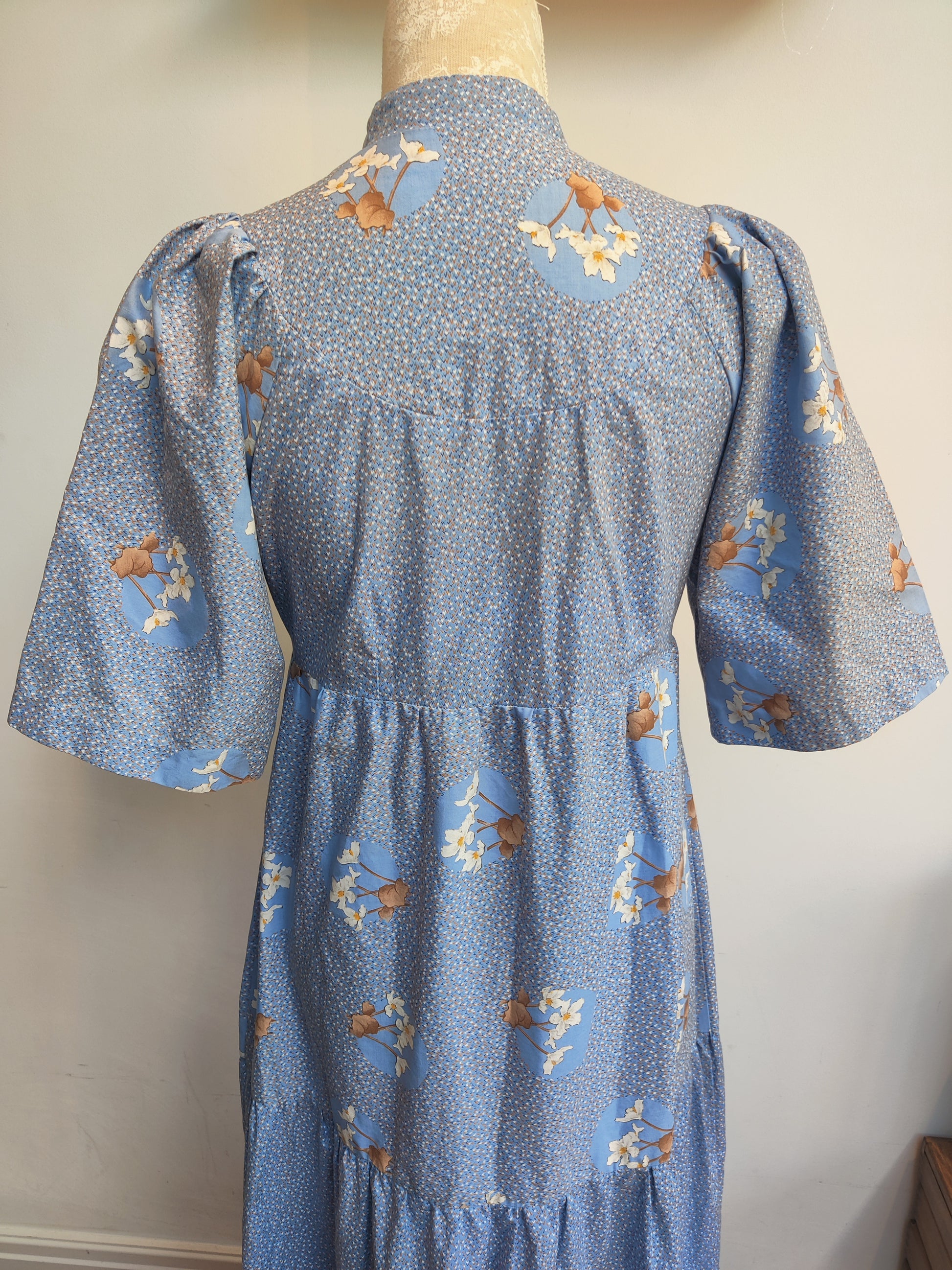 Blue floral 70s dress with short sleeves.
