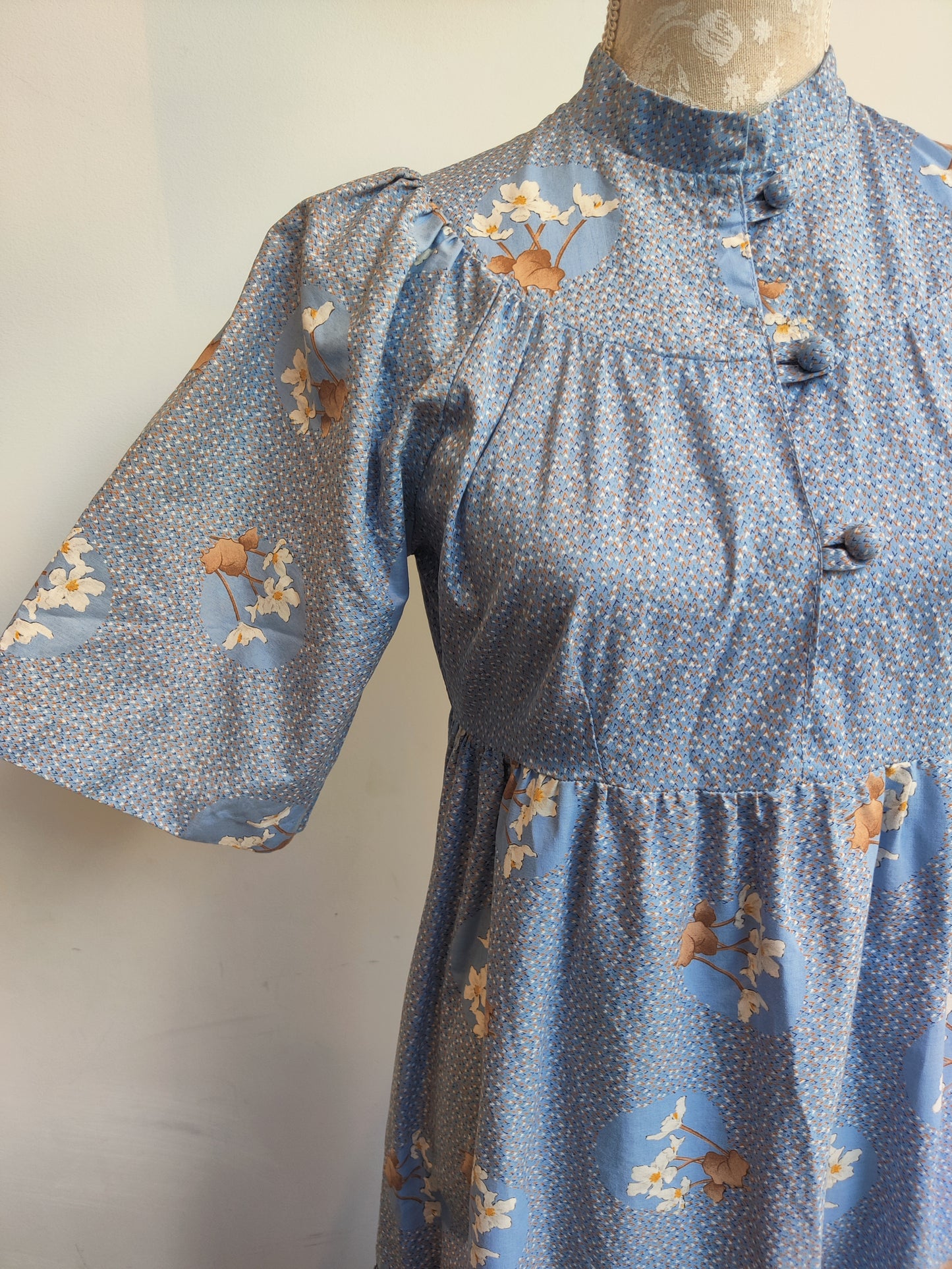 Beautiful floral prairie dress with short sleeves.