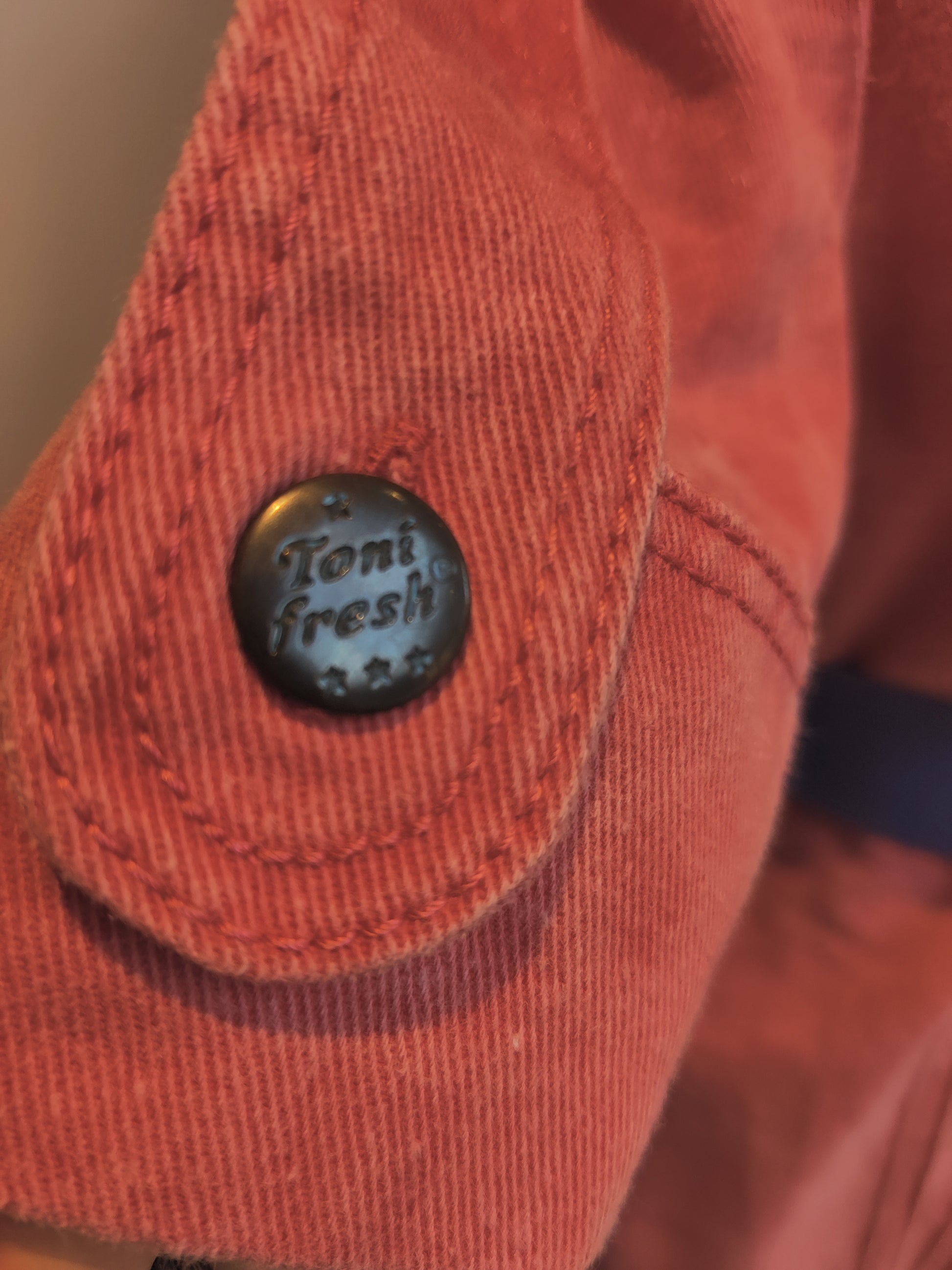Original button detail on denim jacket