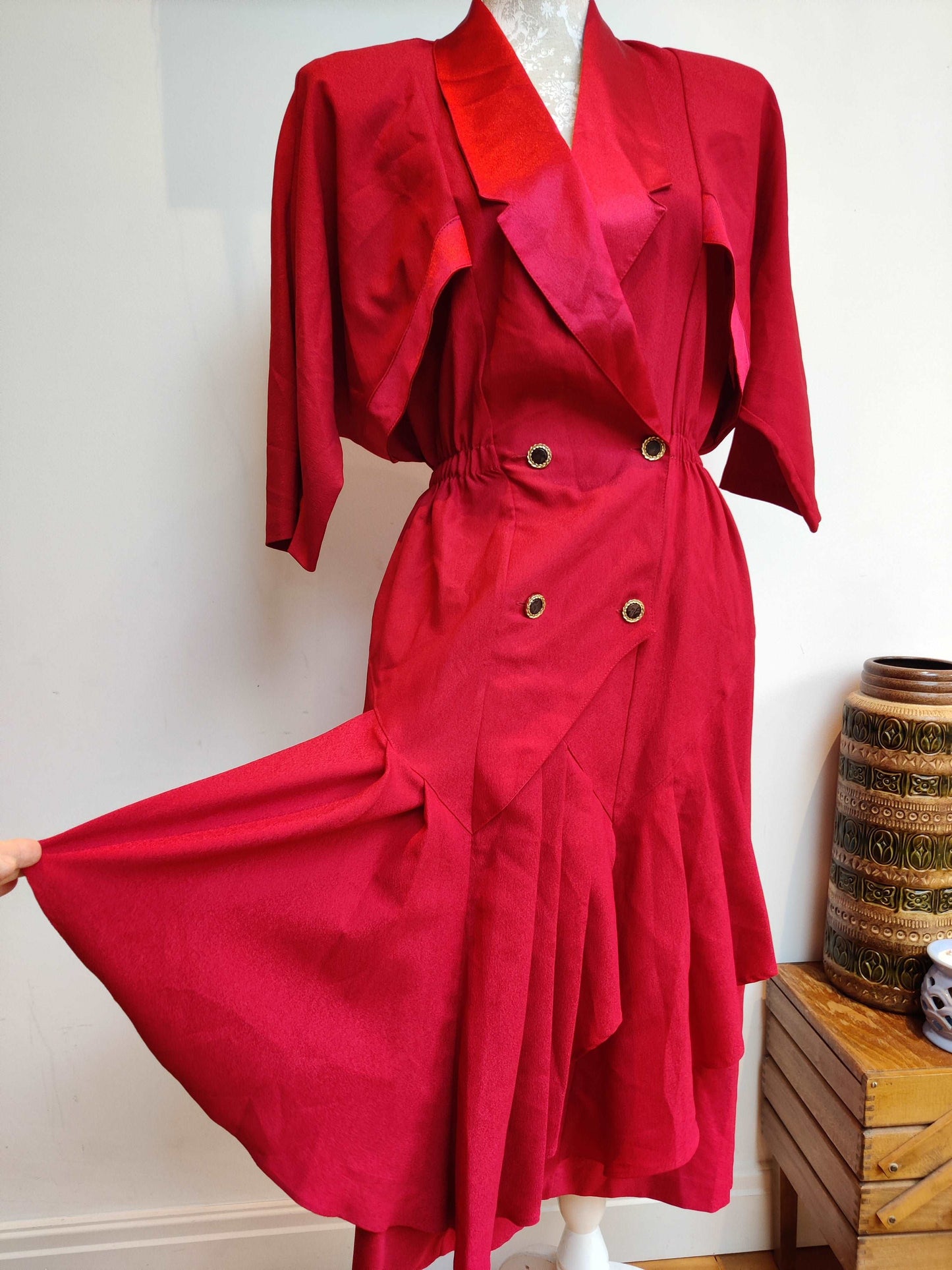 Lovely vintage dress in red with black and gold buttons.
