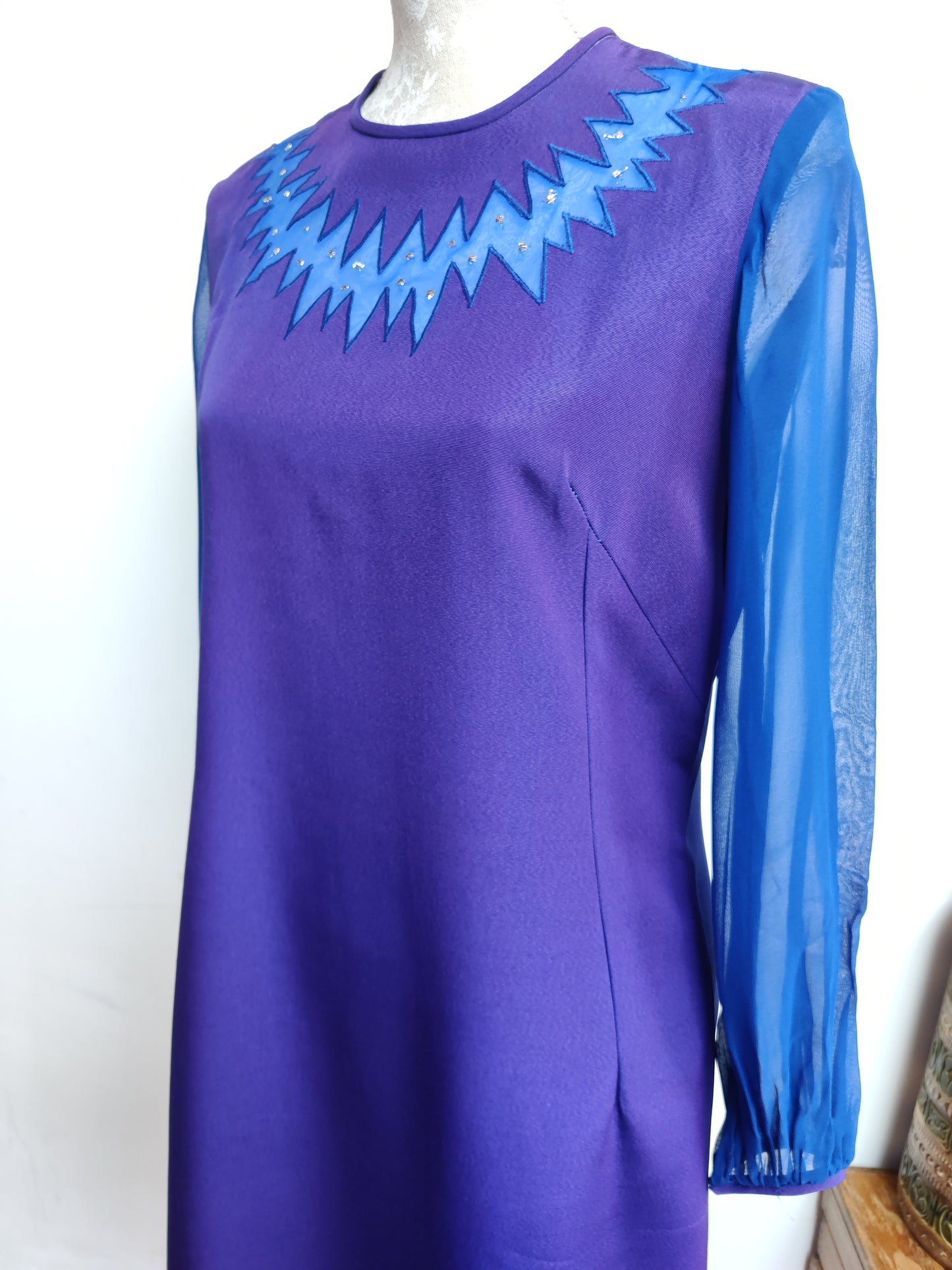 stunning dress with chiffon sleeves in blue and purple.
