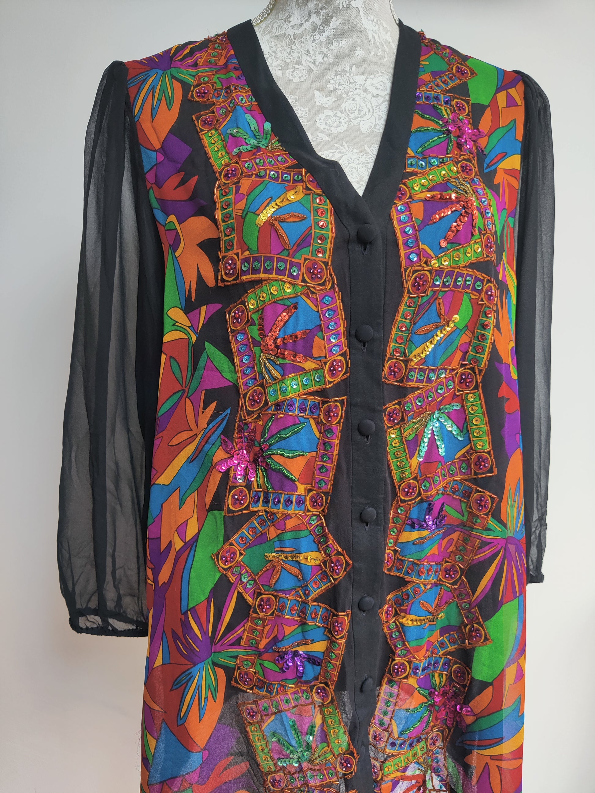 Fun 80s colourful top with semi sheer sleeves