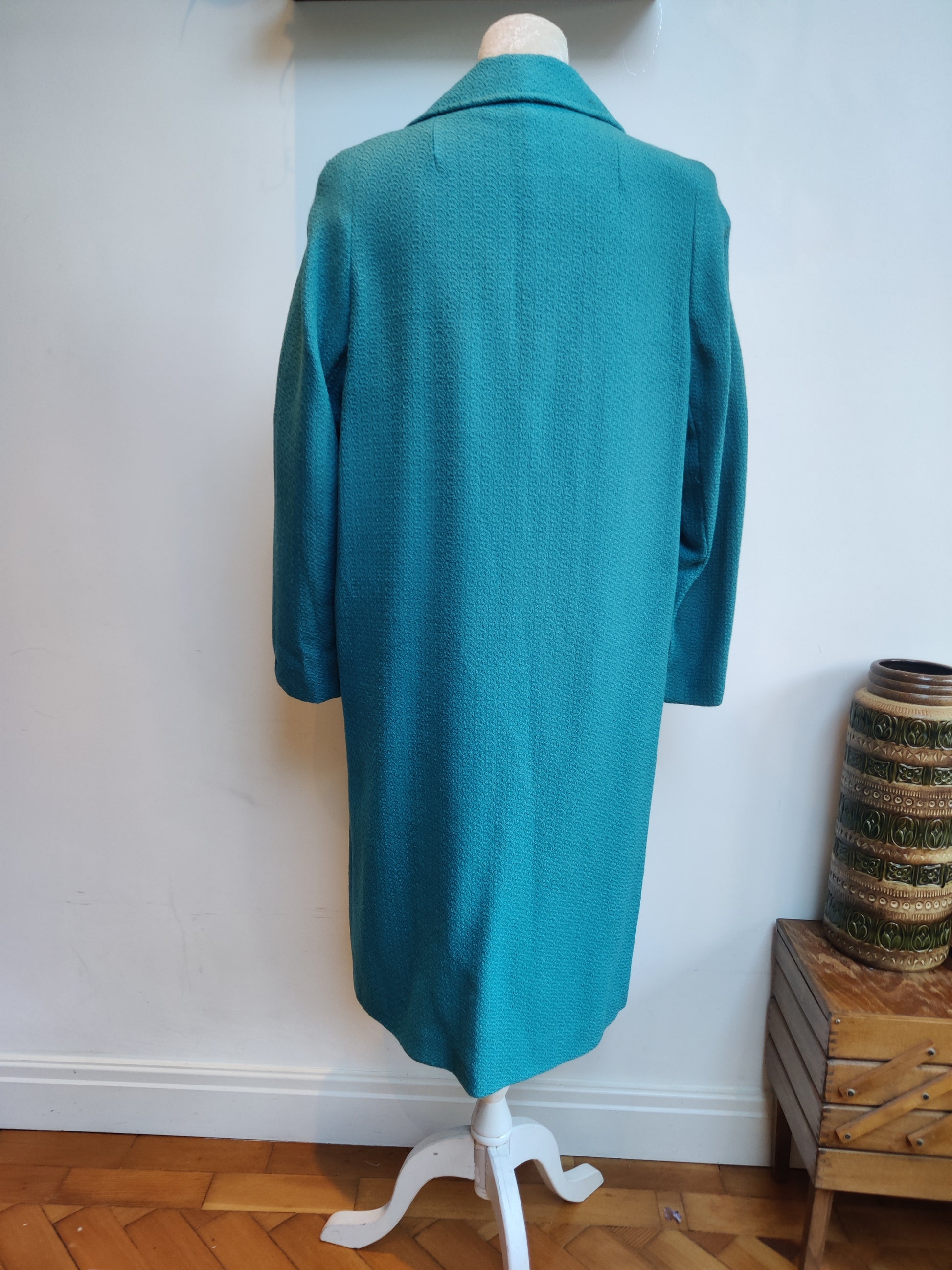 Turquoise vintage coat.