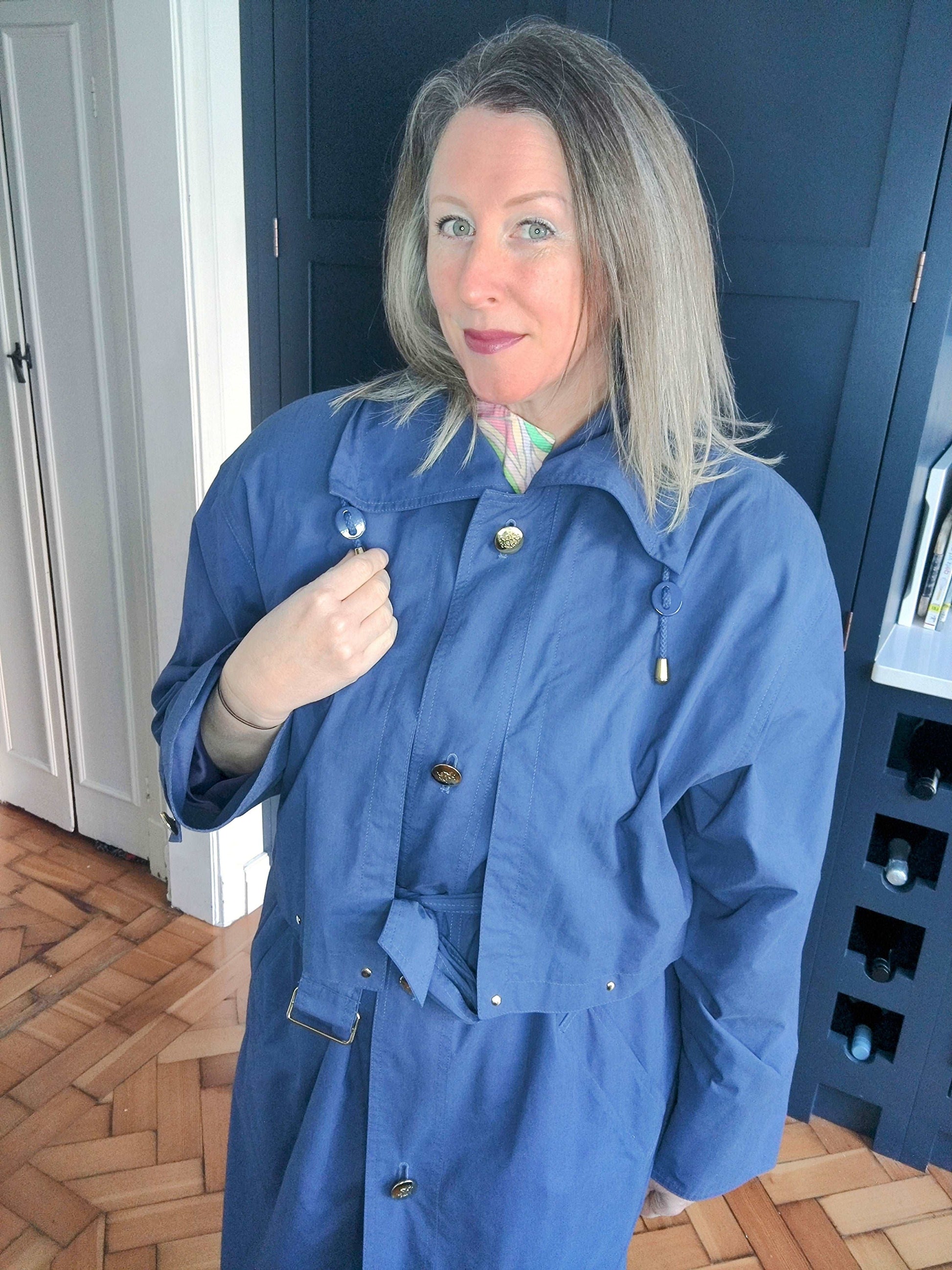 80s navy trenchcoat by Four Seasons. Size 12-14.
