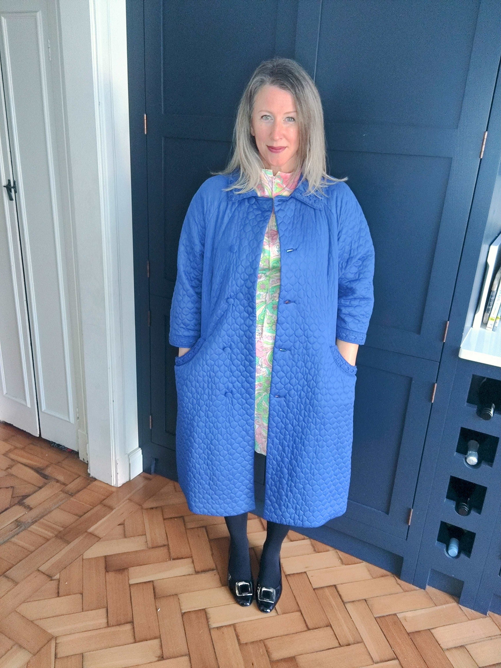 Blue vintage quilted housecoat with lace trim. Size 14.