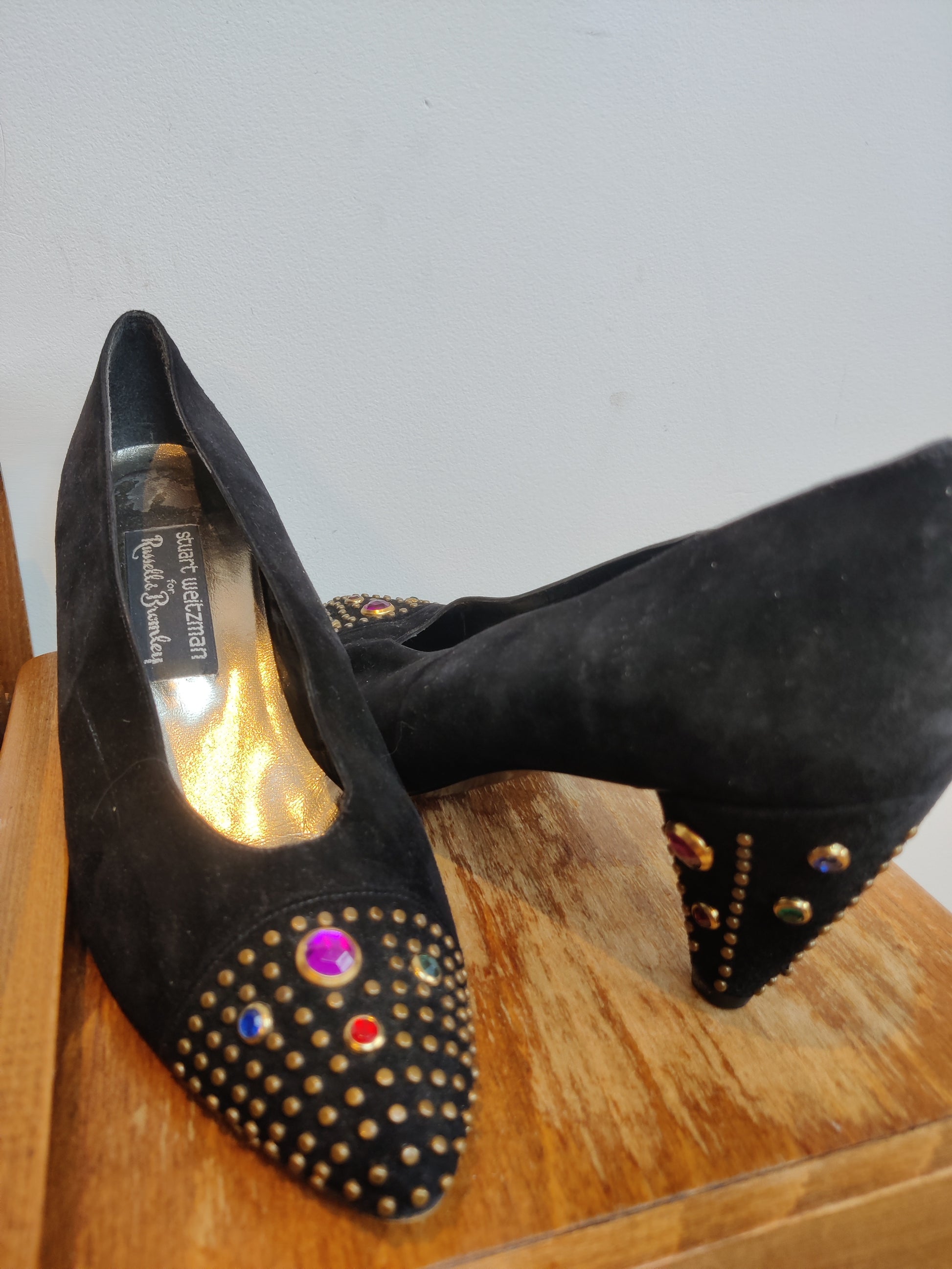 Black suede heels with 80s embellishments
