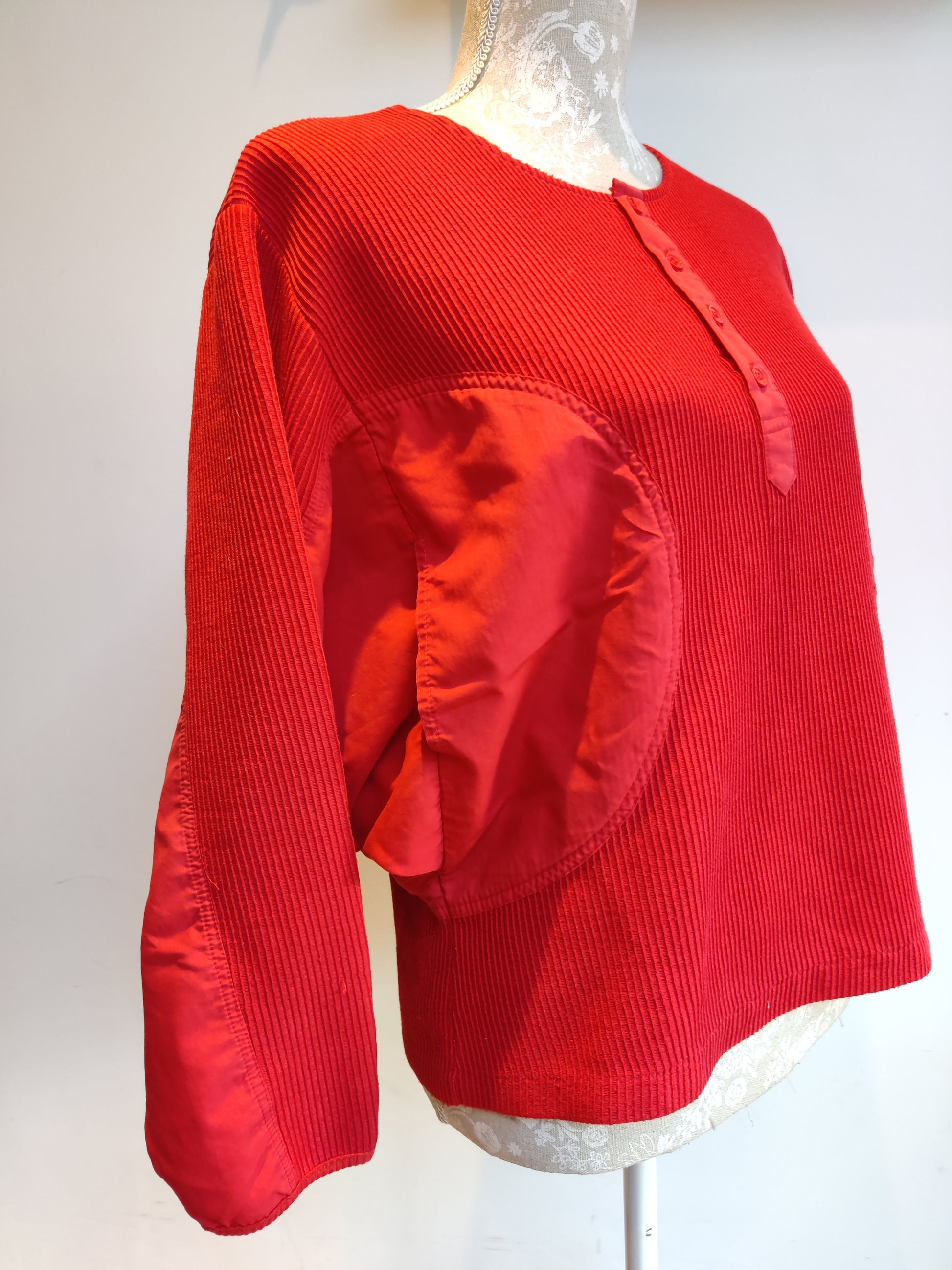 red 80s top with statement pockets