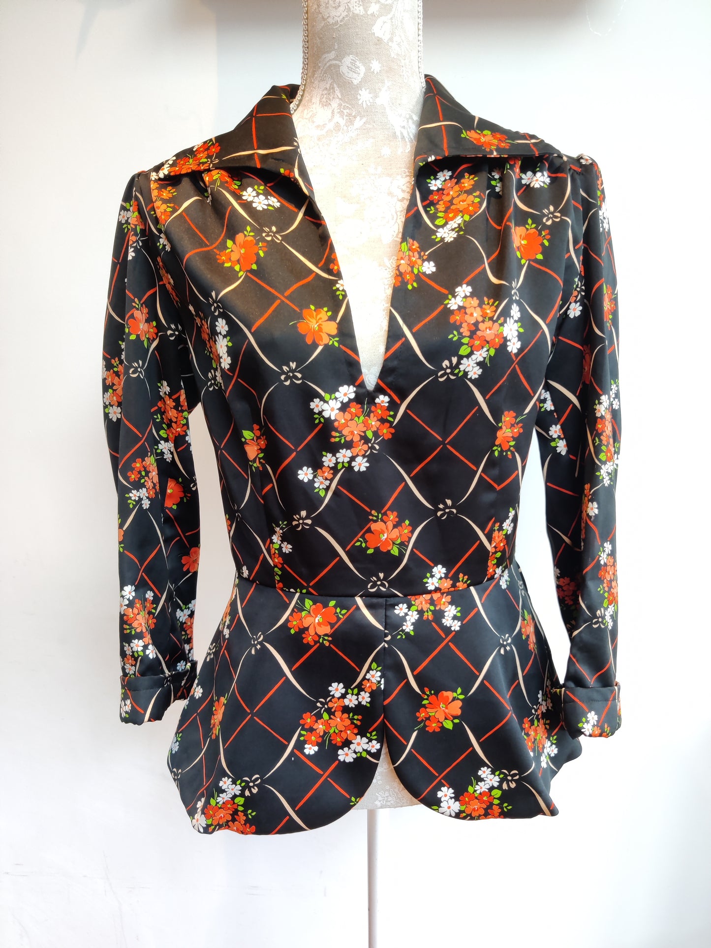 70s peplum top with retro print.