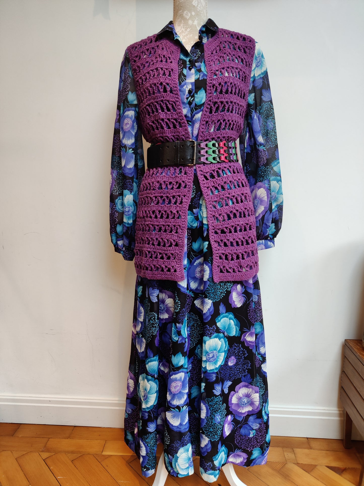 maxi dress styled with belt and crochet waistcoat
