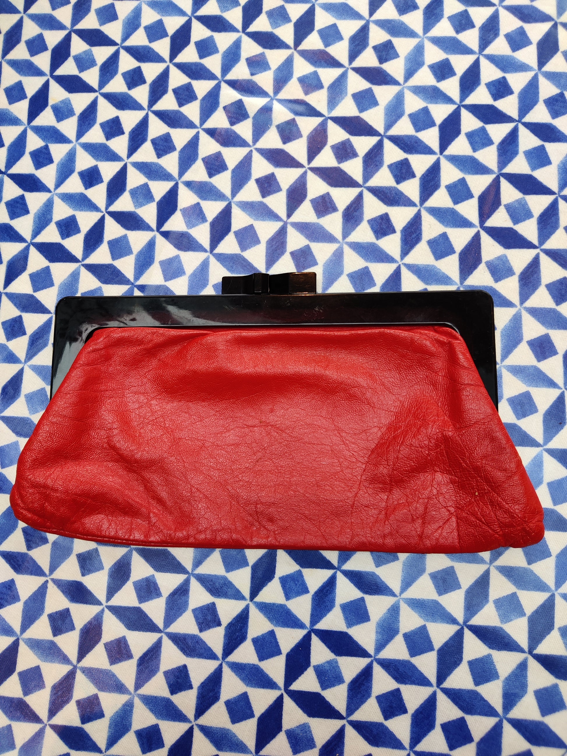 Red vintage clutch bag with black clasp