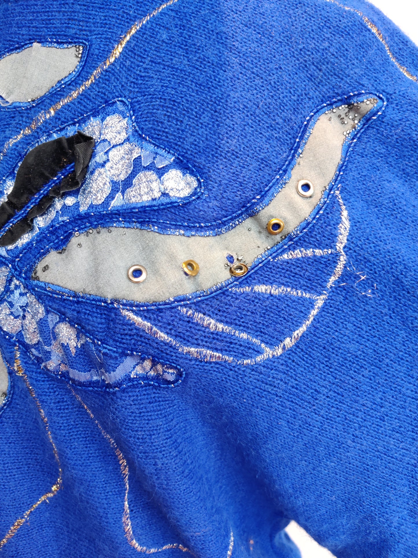 Applique detail with studs and beads