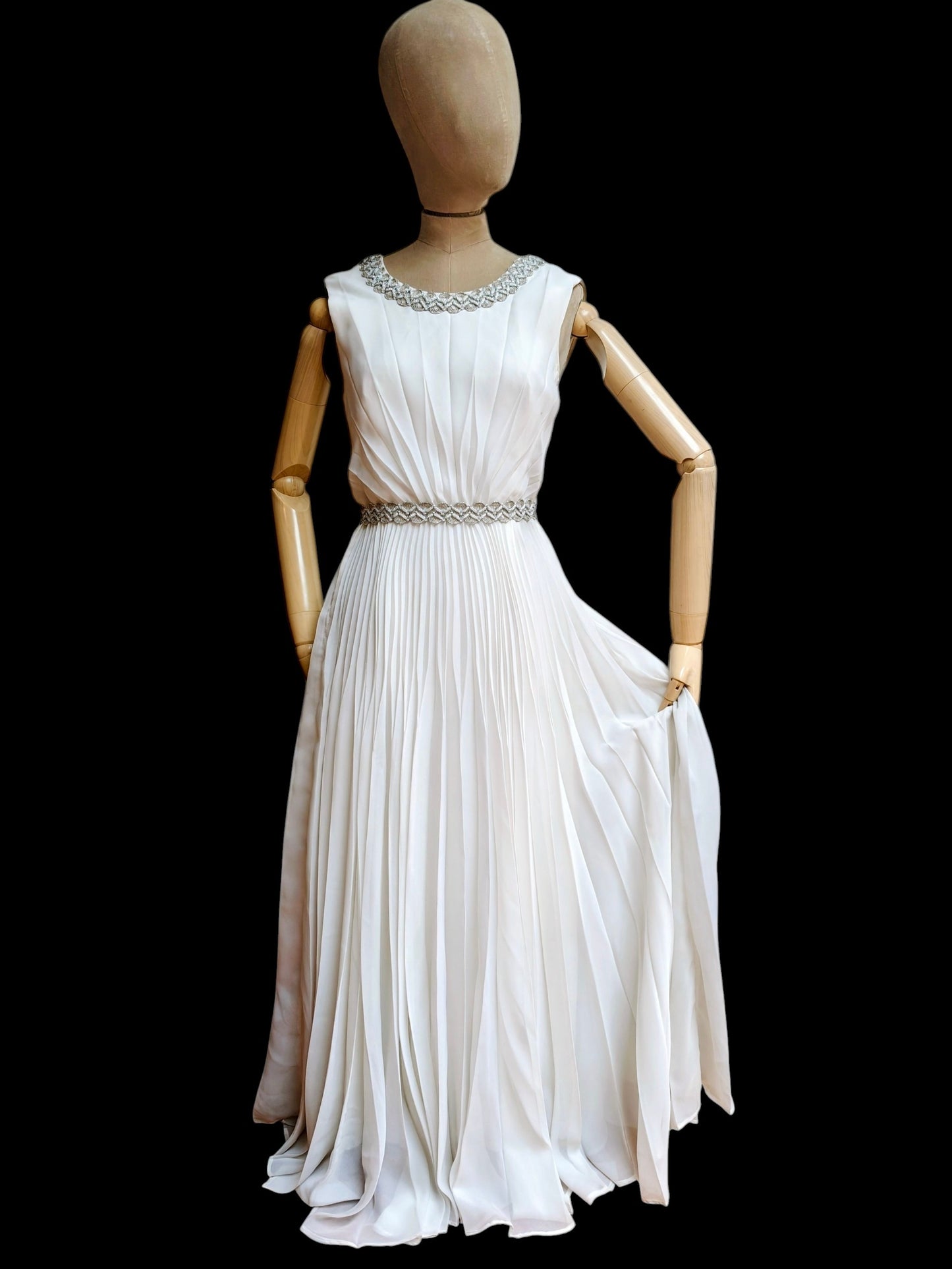 Beautiful 1960's sleeveless white wedding dress with silver embellishments. Size 8.