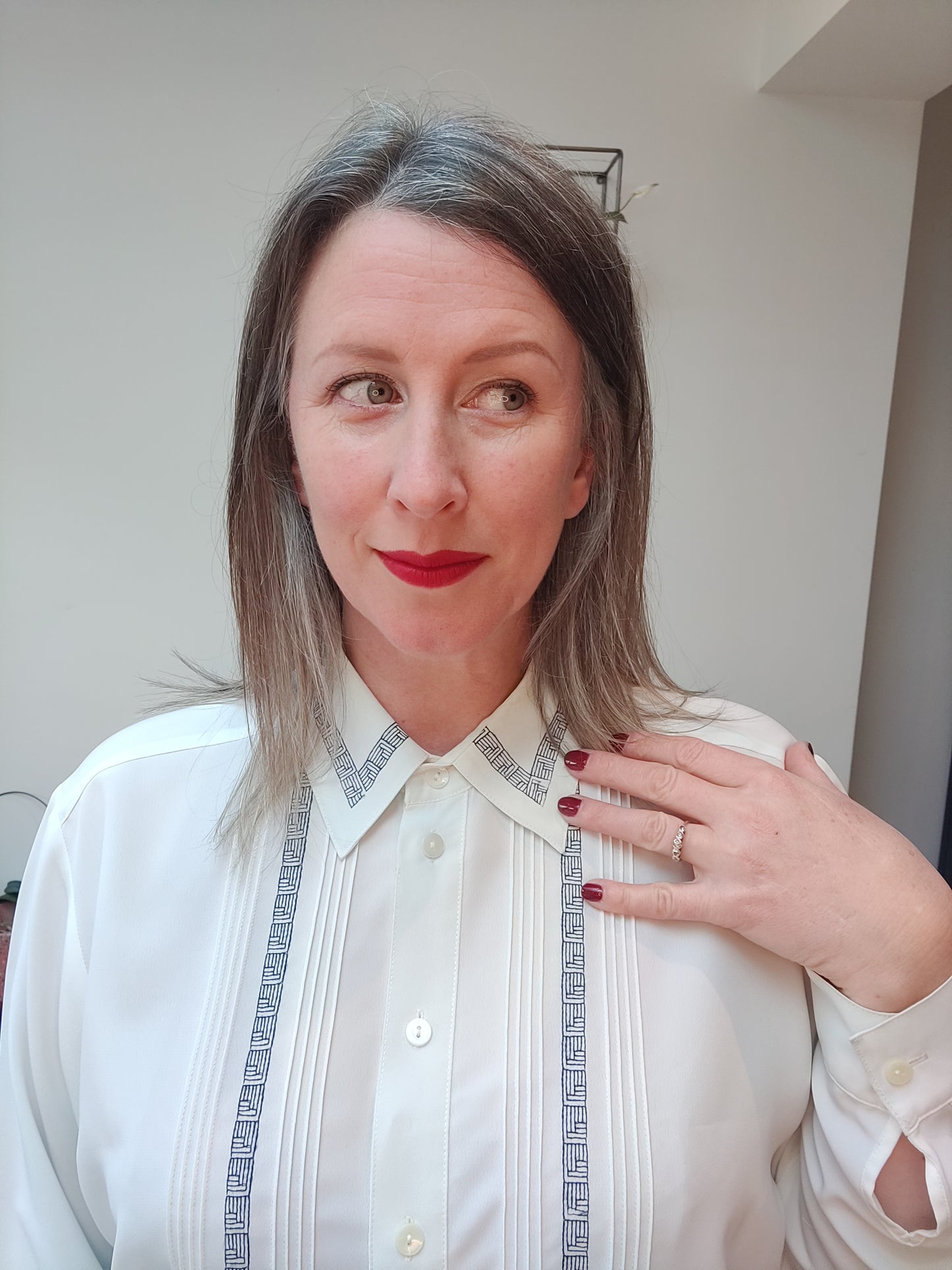 Striking white blouse with abstract navy trim