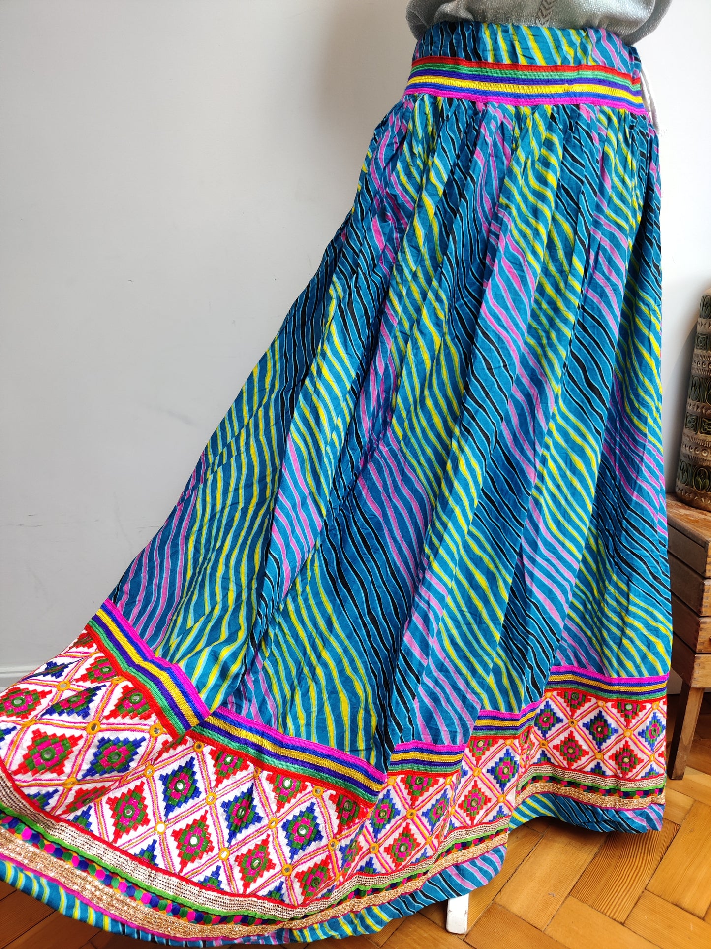 Full skirt with colourful embroidery.
